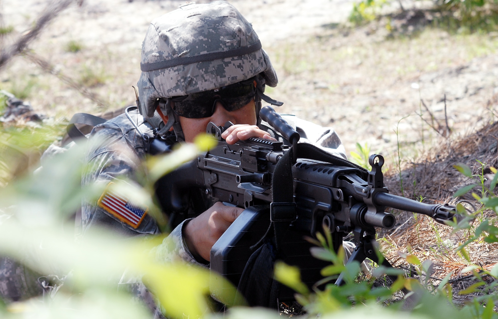 Spc. Edgar River, 145th Surface Maintenance Company, provides security while classmates of the U.S. Army Noncommissioned Officer Academy Fort Dix Warrior Leader Course conduct a security presence patrol inside a simulated Afghan village May 23, 2013, at Joint Base McGuire-Dix-Lakehurst, N.J. The academy recently made history for the U.S. Army Reserve when it completed the first Warrior Leader Course containing more days, new curriculum and Soldier training mandates. (U.S. Army photo bay David Moore/Released)