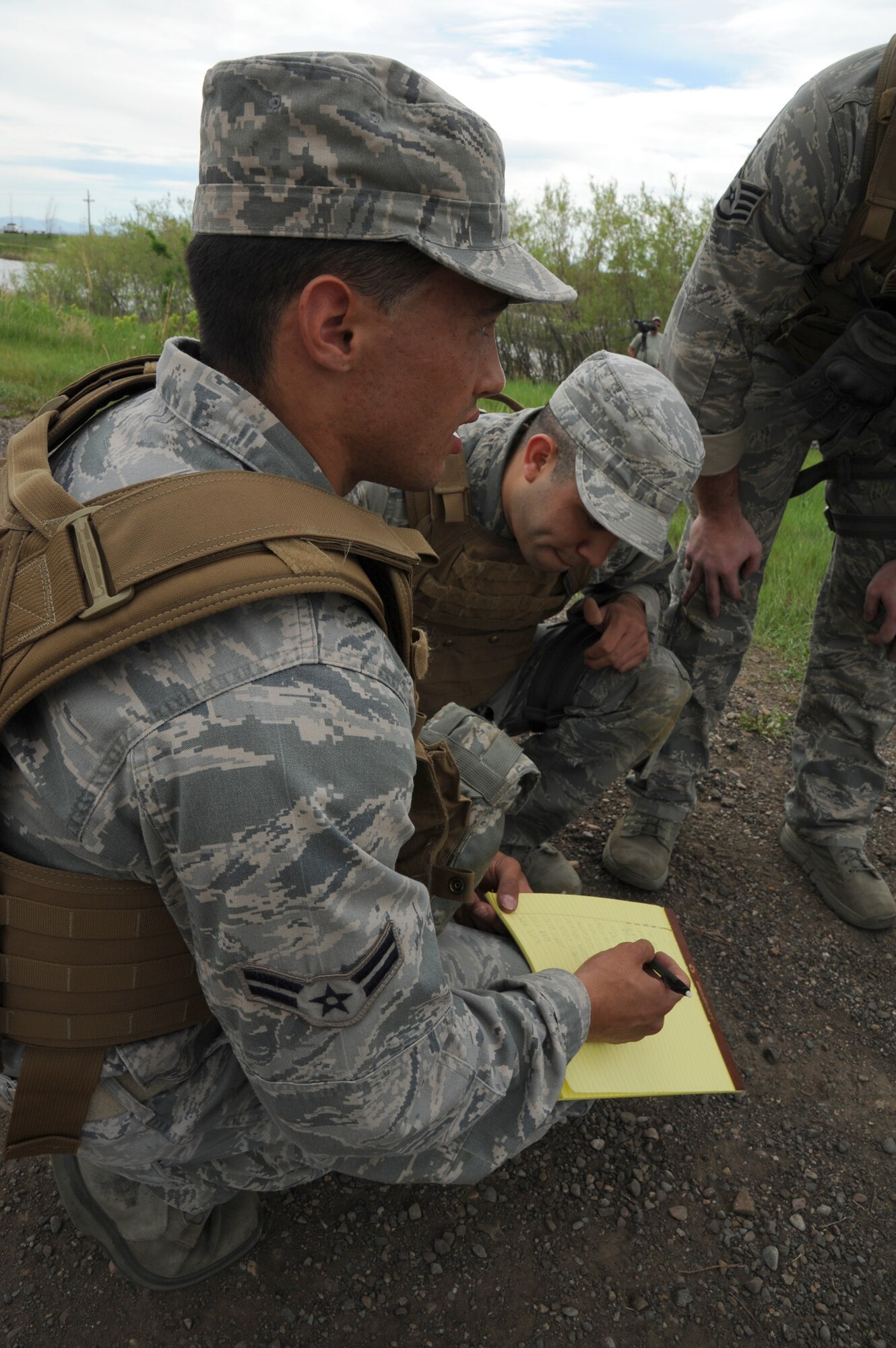 Airman 1st Class Michael Fenex, 341st Security Forces Squadron response force leader, writes down a list of memorized items as Senior Airman Matthew Dubon, 341st Security Forces Group tactical response force member, right, and the rest of his team work together. Fenex, Dubon, Staff Sgt. Dustin Taylor, 341st SFG security response leader, and Staff Sgt. Adam Neal, 341st SFG TRF member, became the eventual winners with a total of 207.5 points, beating out 21 other four-man teams. (U.S. Air Force photo/Senior Airman Katrina Heikkinen)