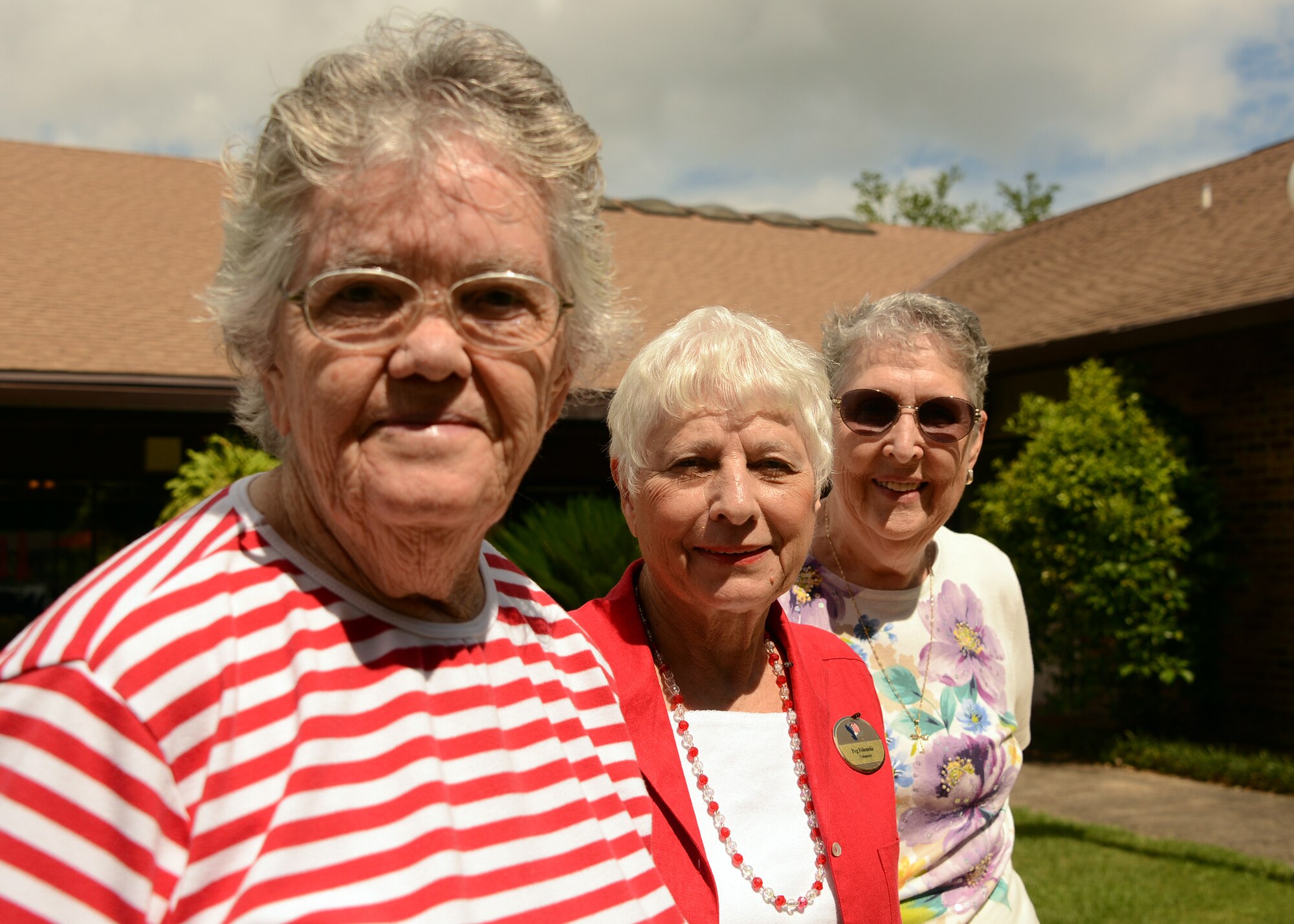 (From left to right) Choyce Sheehan, Peg Polomski and Donna Forget stand for a photograph at Bob Hope Village, Shalimar, Fla., June 3, 2013.