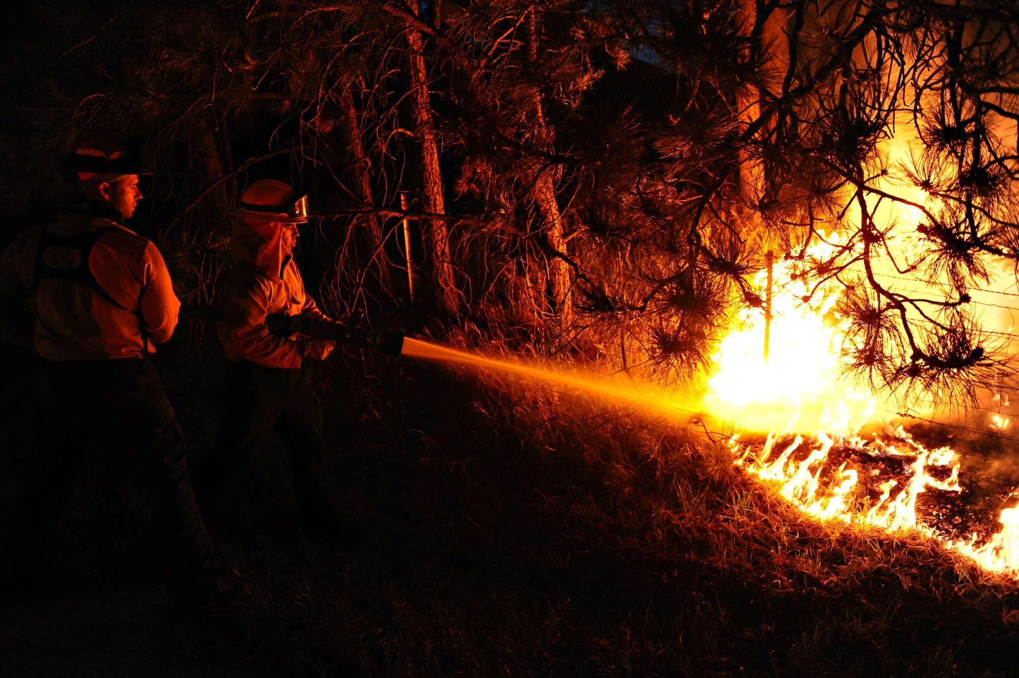 Air Force Academy firefighters battle a hotspot in the Black Forest Fire June 12, 2013. A total of 16 personnel and five vehicles from the Academy have deployed to fight the fire, which has consumed more than 15,000 acres as of June 13. (U.S. Air Force photo/Master Sgt. Christopher DeWitt)