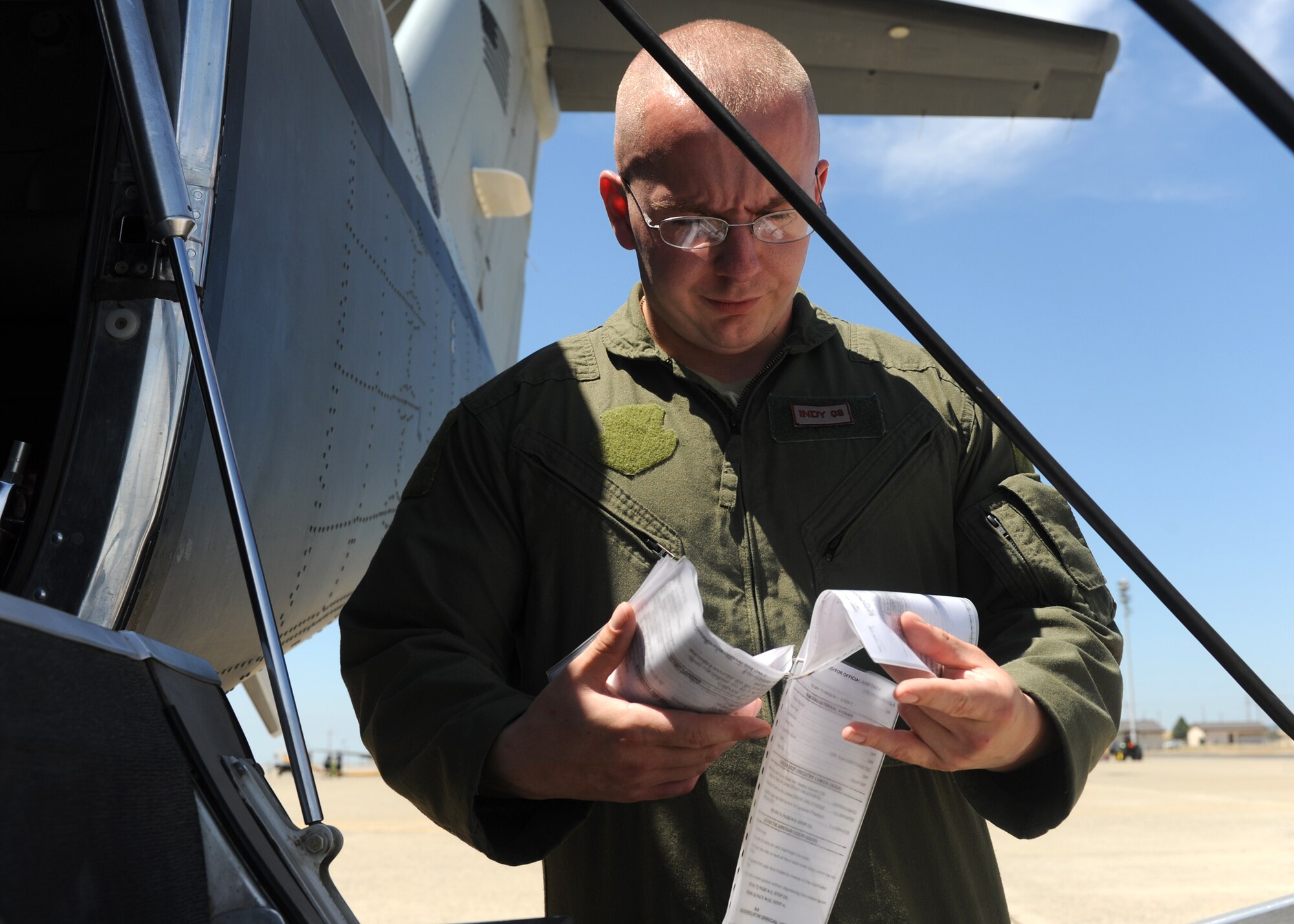 Senior Airman Tyler, 306th Intelligence Squadron, evaluates his pre-flight check list for the MC-12 Liberty aircraft at Beale Air Force Base Calif., June 12, 2013. Tyler was recently accepted into the Air Force Academy Prep School through the Leaders Encouraging Airmen Development (LEAD) program. (U.S. Air Force photo by Airman 1st Class Bobby Cummings)