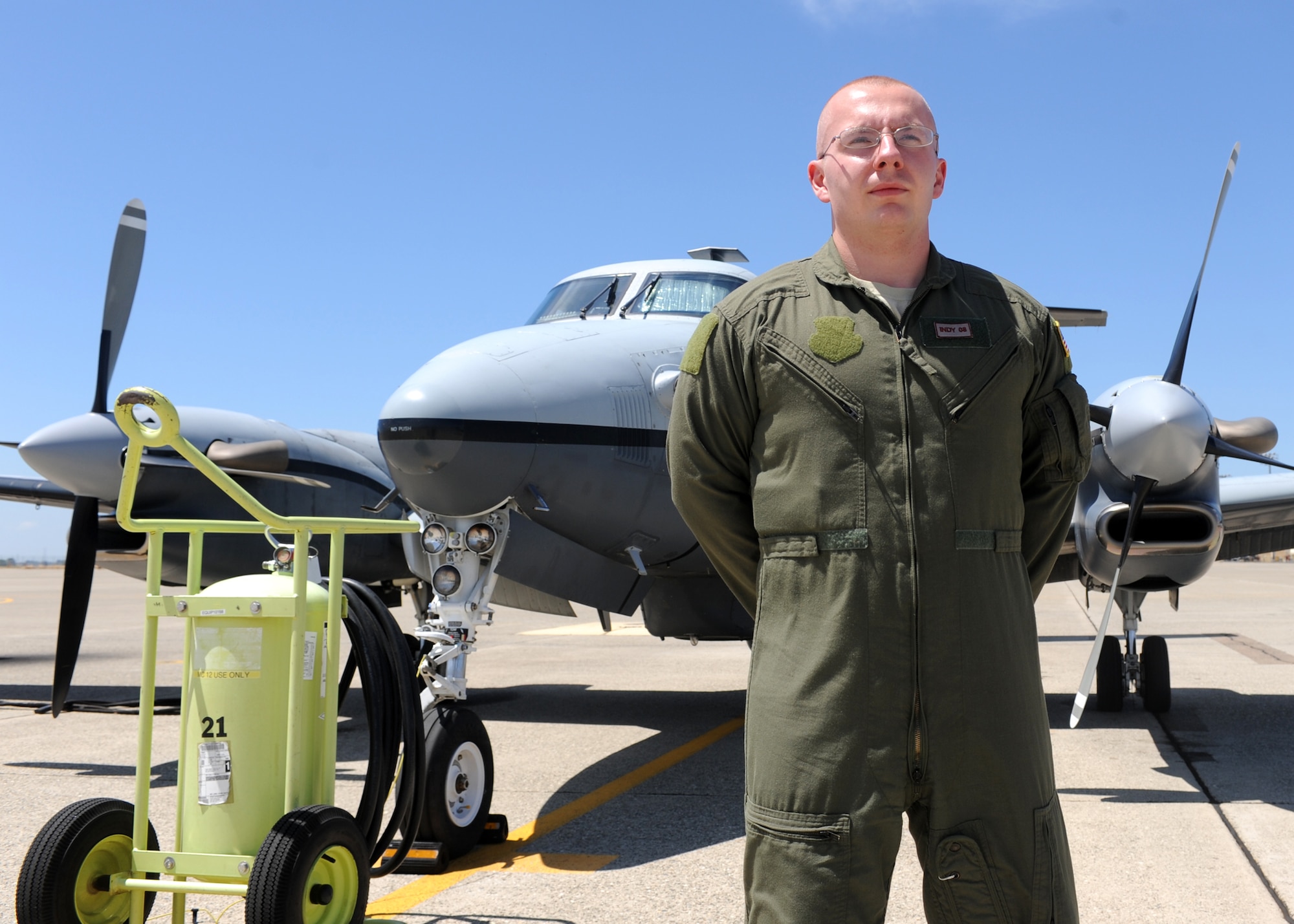Senior Airman Tyler, 306th Intelligence Squadron, stands in front of a MC-12 Liberty aircraft at Beale Air Force Base Calif., June 12, 2013. Tyler was recently accepted into the Air Force Academy Prep School through the Leaders Encouraging Airmen Development (LEAD) program. (U.S. Air Force photo by Airman 1st Class Bobby Cummings)
