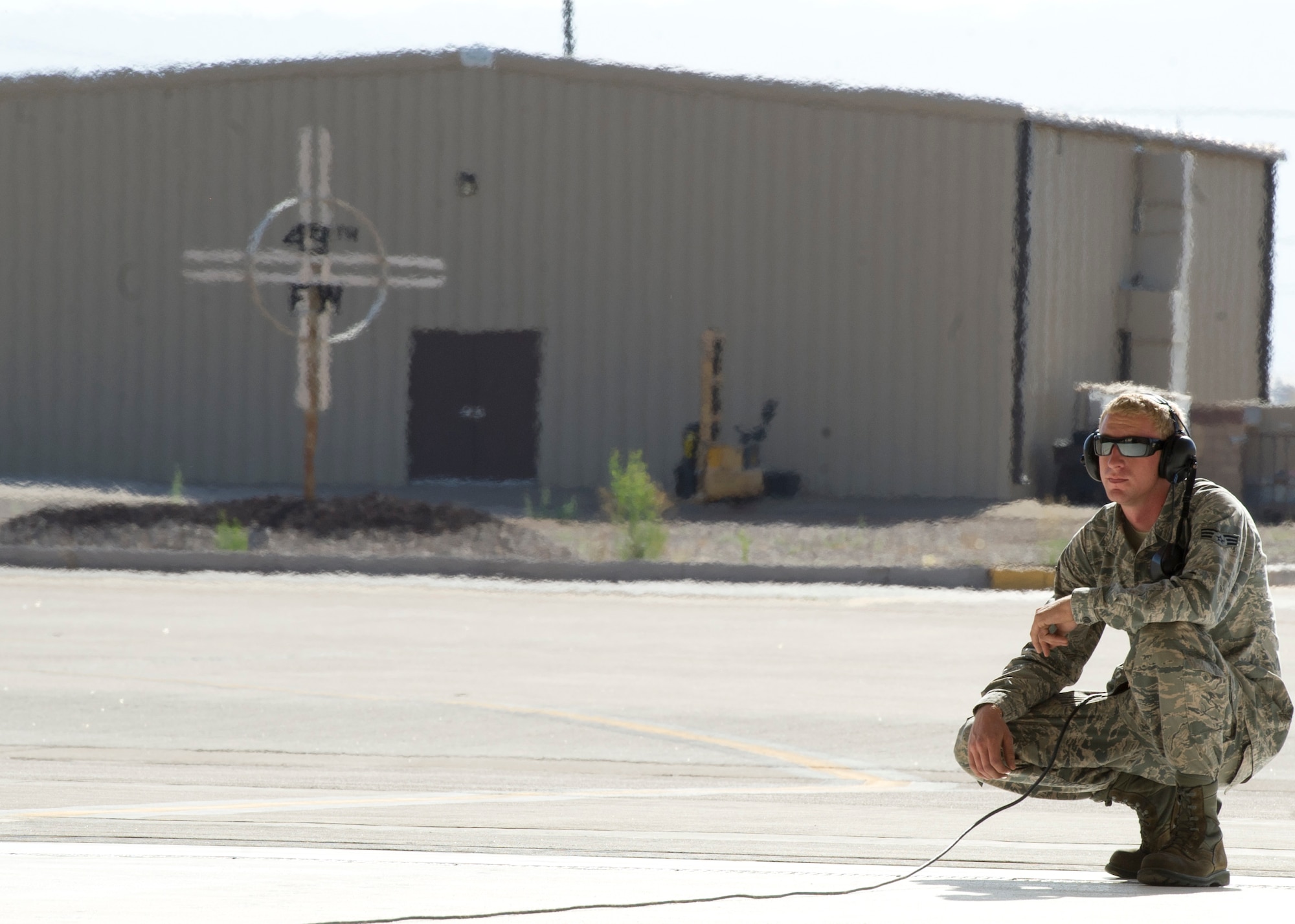 Senior Airman Joshua Lomax, 7th Aircraft Maintenance Unit crew chief, checks the exhaust of an F-22 Raptor during pre-flight checks at Holloman Air Force Base, N.M., June 7. The 7th FS flew F-22s this in support of Operation Noble Eagle. ONE.is the name given to the United States and Canadian military operations related to homeland security and support to federal, state, and local agencies. The ongoing operation began September 14, 2001, in response to the September 11 attacks. (U.S. Air Force photo by Senior Airman DeAndre Curtiss/Released)