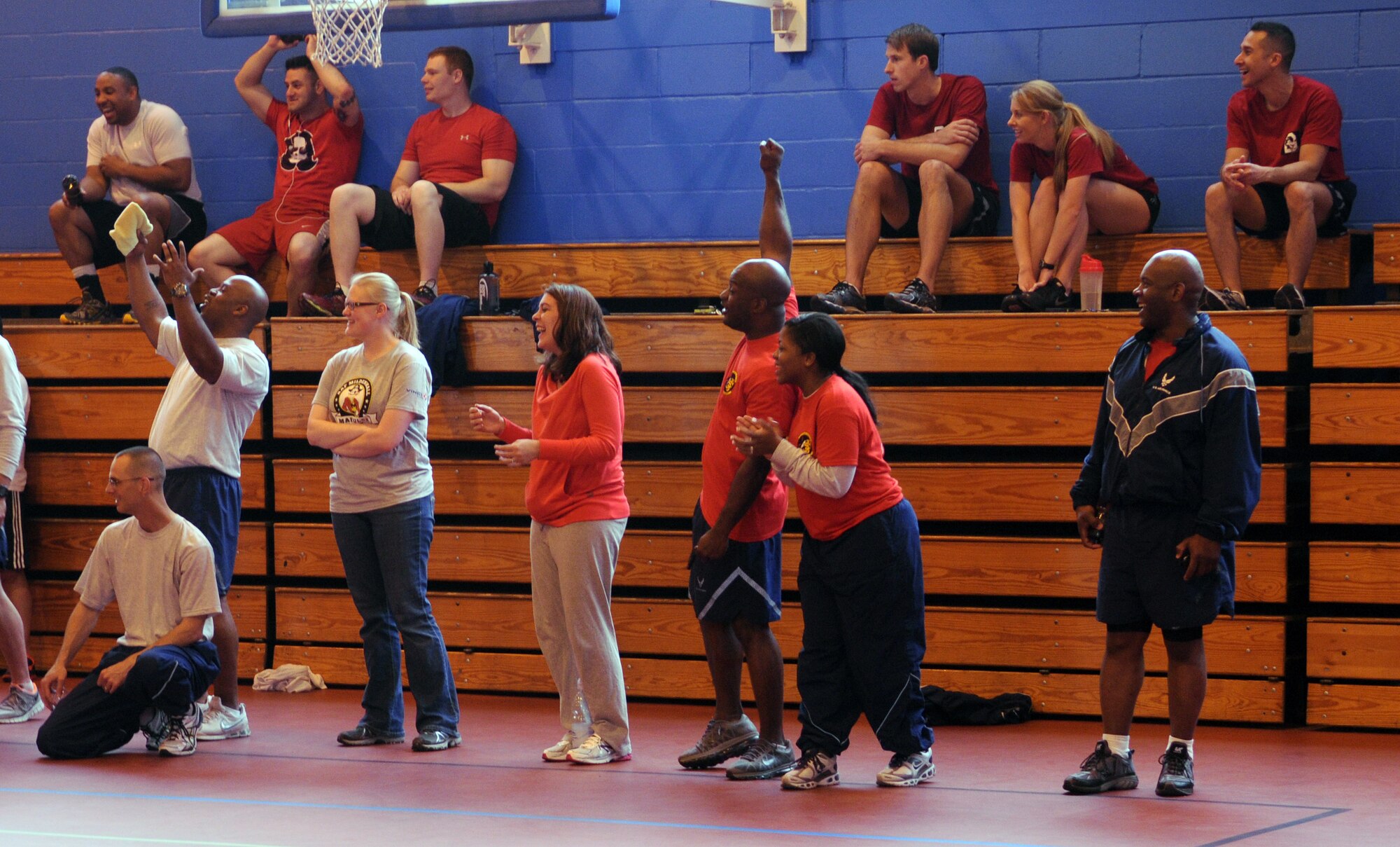 Team Mildenhall Airmen root for their squadrons at a dodgeball tournament during the Marauder Melee June 13, 2013, at the North Side Fitness Center on RAF Mildenhall, England.  The Marauder Melee, a sports and family day open to all base pass holders, incorporated squadron sports events at various locations on base. (U.S. Air Force photo by Staff Sgt. Tabitha M. Lee/Released)
