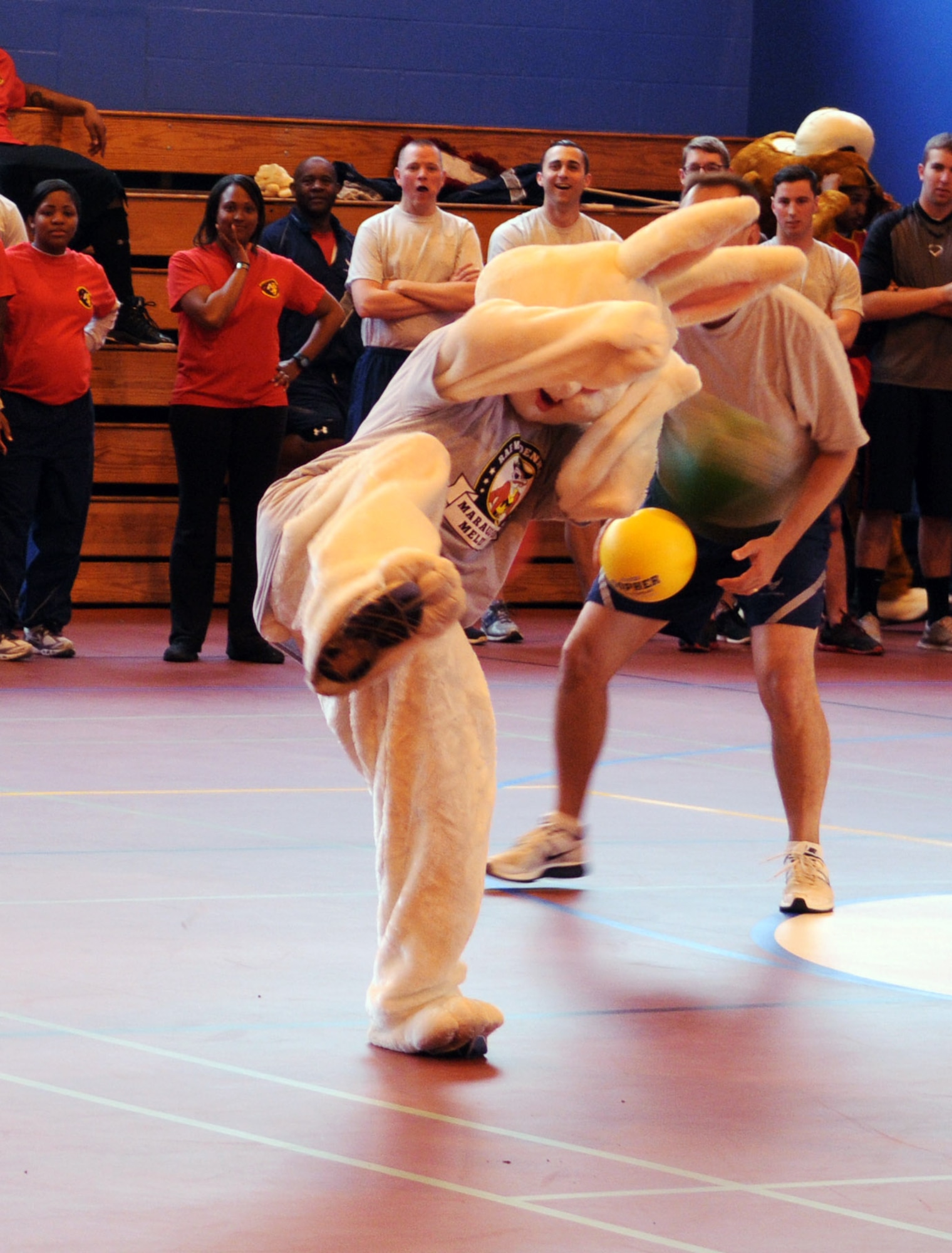 Bunny, an Airman in costume, avoids being hit by a ball during a dodgeball tournament June 13, 2013, at the North Side Fitness Center on RAF Mildenhall, England.  The tournament was one of the Marauder Melee squadron sports events.  The event also included family-fun activities in Washington Square with free barbecue, food booths, military static displays and demonstrations, and a mascot race. (U.S. Air Force photo by Staff Sgt. Tabitha M. Lee/Released)