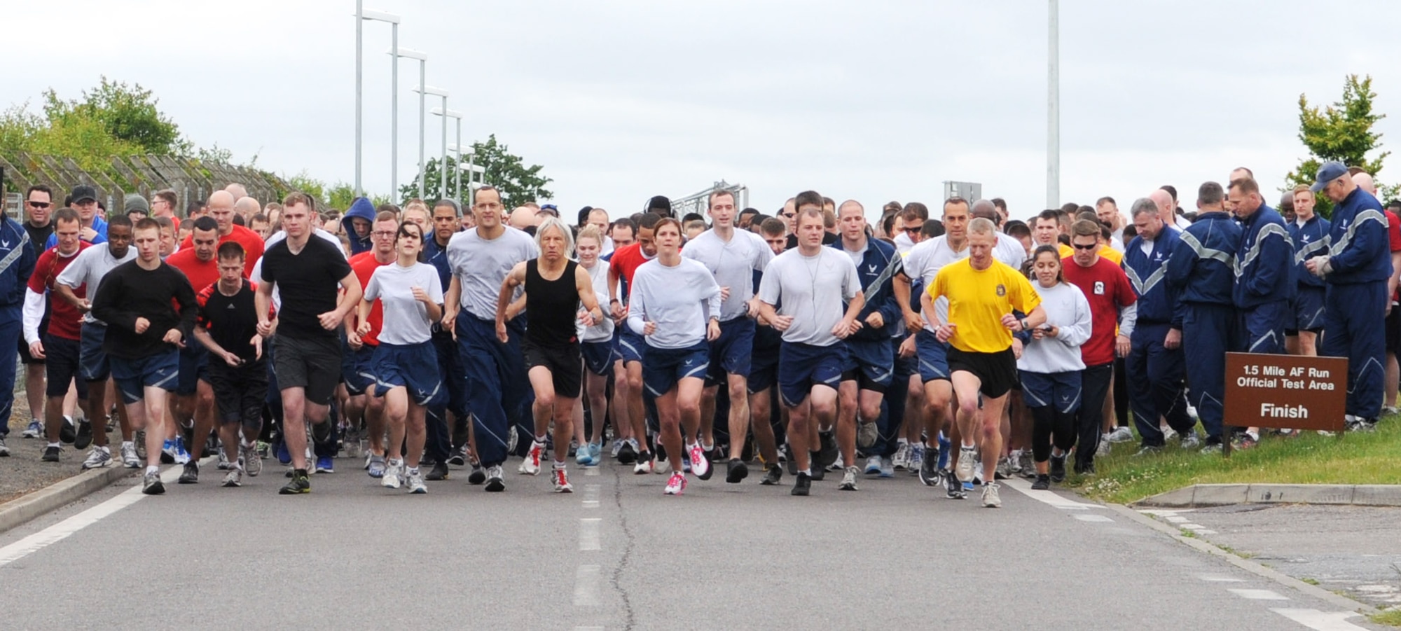 Team Mildenhall Airmen participate in a 5K kicking off the Marauder Melee June 13, 2013, at the Hardstand Fitness Center on RAF Mildenhall, England. The Marauder Melee, a sports and family day open to all base pass holders, had squadron sports events at various locations on base. (U.S. Air Force photo by Staff Sgt. Tabitha M. Lee/Released)