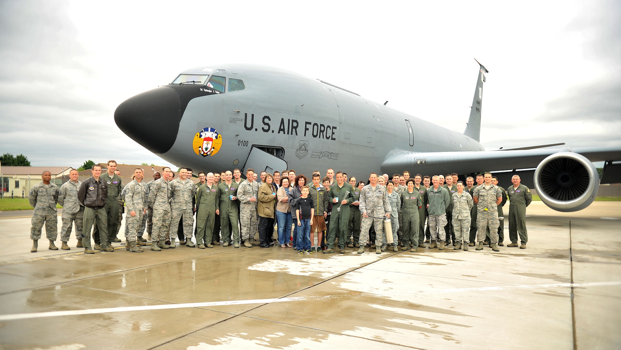 Team Mildenhall members pose for a group photo following Col. Christopher Kulas’, 100th Air Refueling Wing commander, fini flight June 12, 2013, on RAF Mildenhall, England. The traditional fini flight commemorated Kulas’ time as base commander. (U.S. Air Force photo by Staff Sgt. Jerilyn Quintanilla/Released)