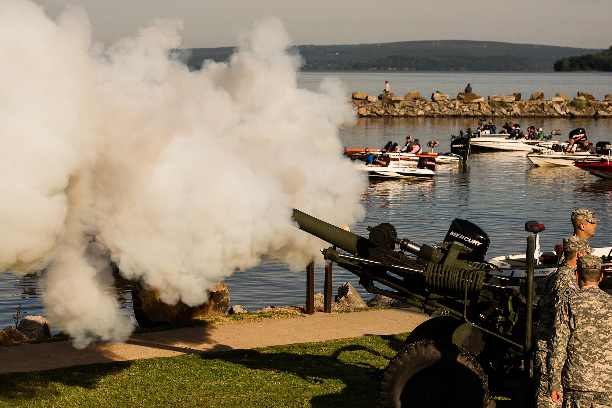 Members of the Arkansas Army National Guard fire a Howitzer cannon to signal the start of the Wounded Warrior Project bass fishing tournament June 8, 2013, at Lake Dardanelle, Ark. More than 30 wounded warriors participated in the first of what organizers hope will be an annual event.  (U.S. Air Force photo by Staff Sgt. Russ Scalf)