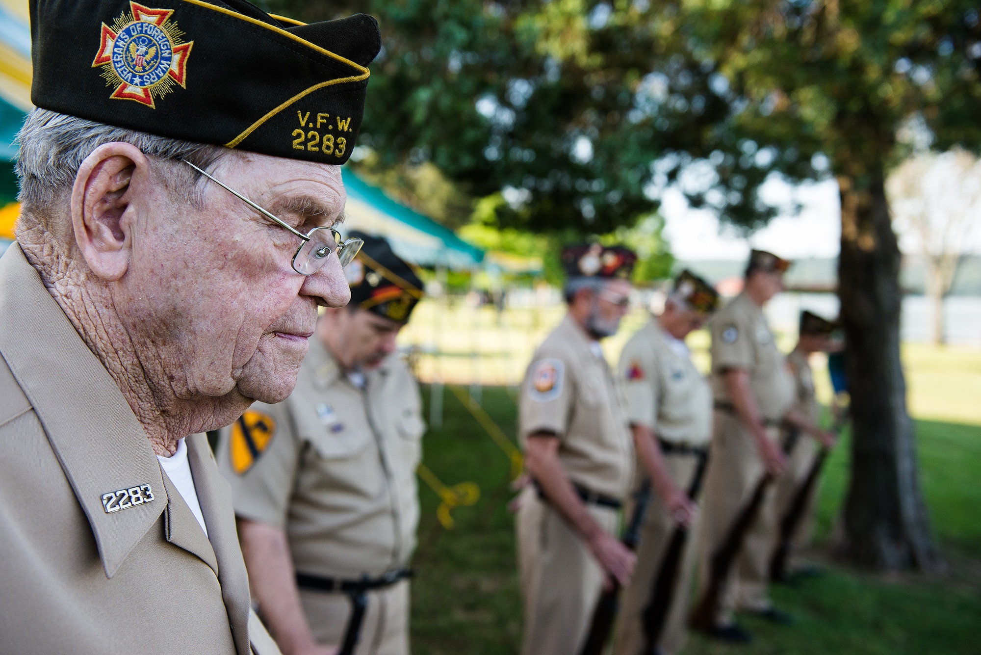 Members of Veterans of Foreign Wars Post 2283, located in Russellville, Ark., bow their heads during the invocation at the Wounded Warrior Project bass fishing tournament June 8, 2013, at Lake Dardanelle, Ark. The tournament, held in cooperation with the Arkansas Wildlife Federation, partnered wounded veterans with local volunteer boat captains for a day of relaxation on the lake.     (U.S. Air Force photo by Staff Sgt. Russ Scalf)
