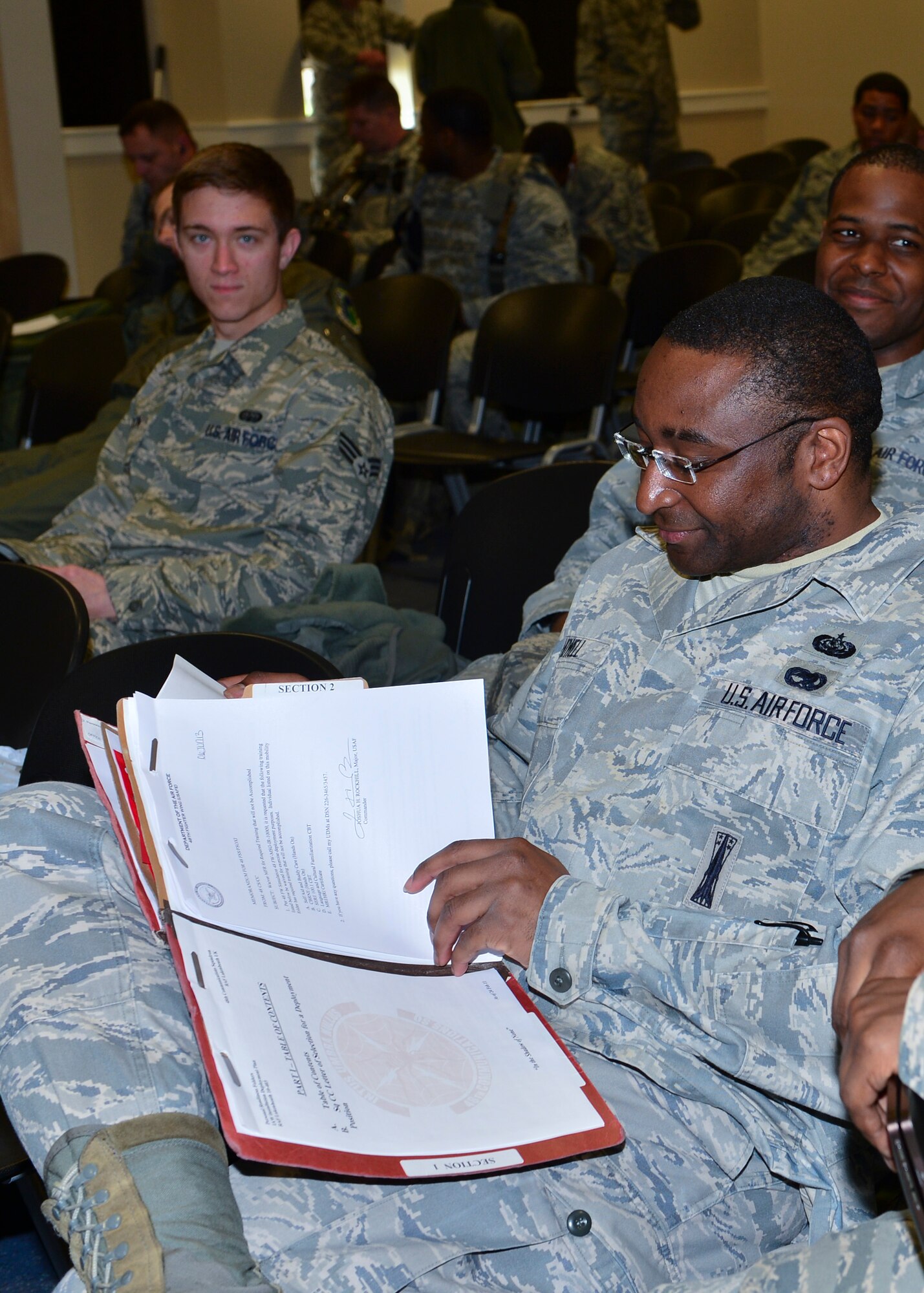 ROYAL AIR FORCE LAKENHEATH, England – Staff Sgt. Jermaine Howell, 48th Communications Squadron information systems security manager, reviews his mobility folder June 10, 2013. RAF Lakenheath Airmen participated in a Phase I exercise, where they deployed more than 450 Airmen and generated aircraft sorties. The Airmen were maintaining proficiency at generating sorties for deployment within 96 hours. (U.S. Air Force photo by Staff Sgt. Stephanie Mancha)