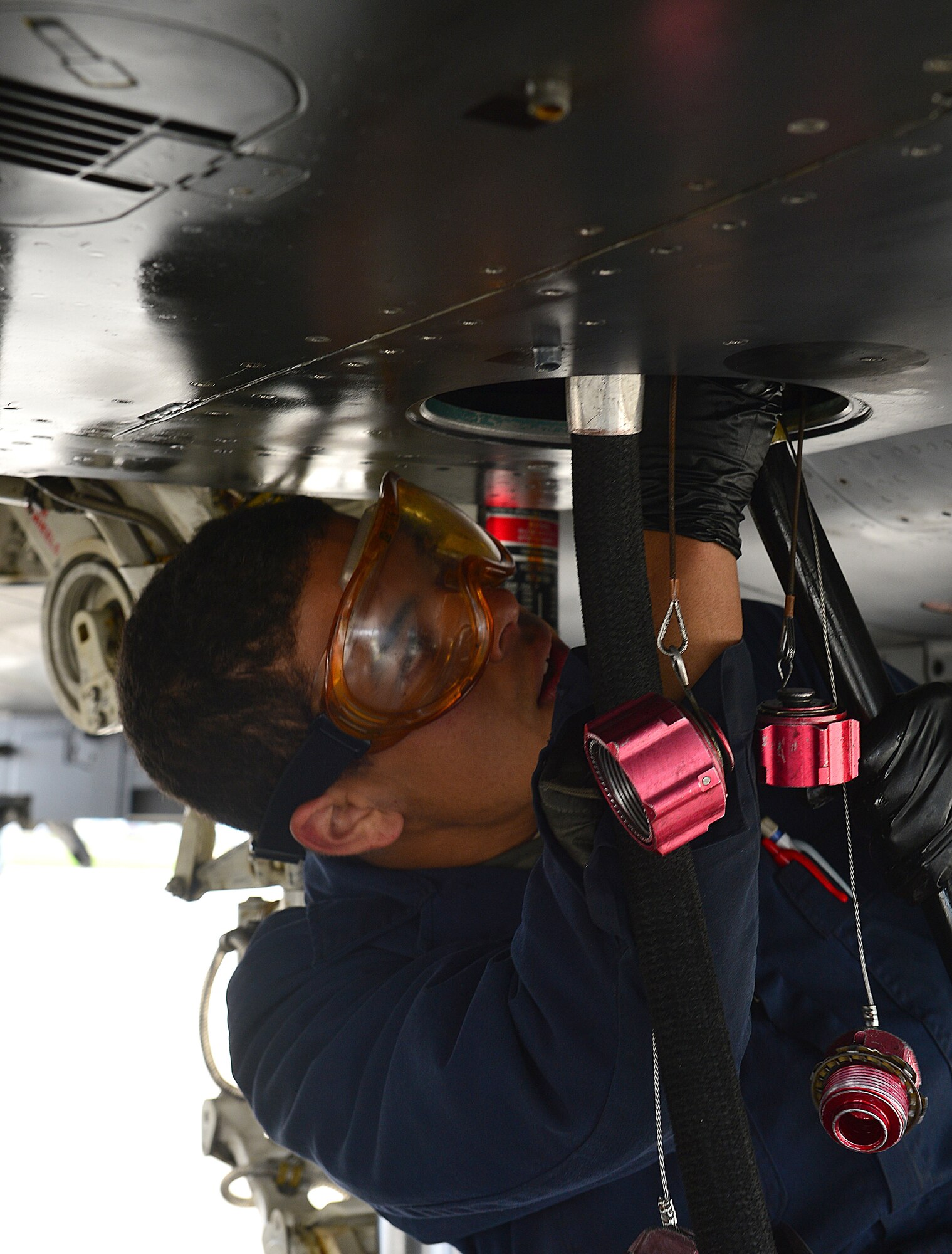 ROYAL AIR FORCE LAKENHEATH, England – Airman 1st Class Isaiah Freeman, 48th Aircraft Maintenance Squadron crew chief, connects a hydraulic test stand to a utility system during a Phase I exercise June 10, 2013. RAF Lakenheath “deployed” cargo and more than 450 Airmen, and generated aircraft sorties. The Airmen were maintaining proficiency at generating sorties for deployment within 96 hours. (U.S. Air Force photo by Staff Sgt. Stephanie Mancha)