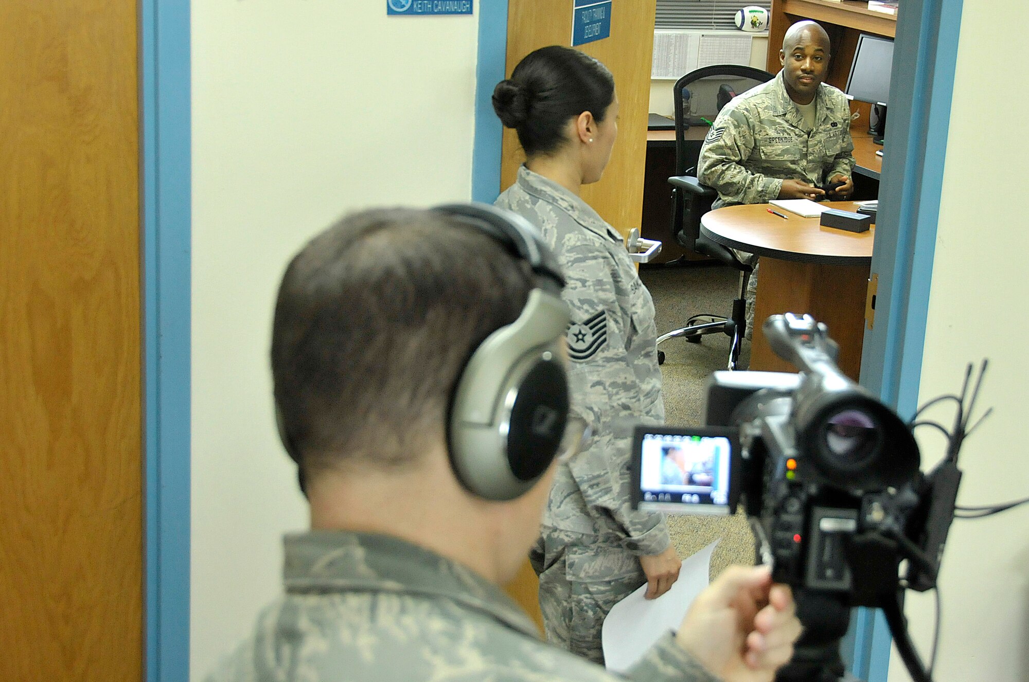 MCGHEE TYSON AIR NATIONAL GUARD BASE, Tenn. – Air National Guard Tech. Sgt. Matt Schwartz, broadcaster at the I. G. Brown Training and Education Center here directs Tech. Sgt. Jenny Sanchez and Tech. Sgt. Kasimu Greenidge while filming a training video on enlisted performance reports. The Center produced the video to help train Air National Guard members on EPR writing. (U.S. Air National Guard photo by Master Sgt. Mike R. Smith/Released)