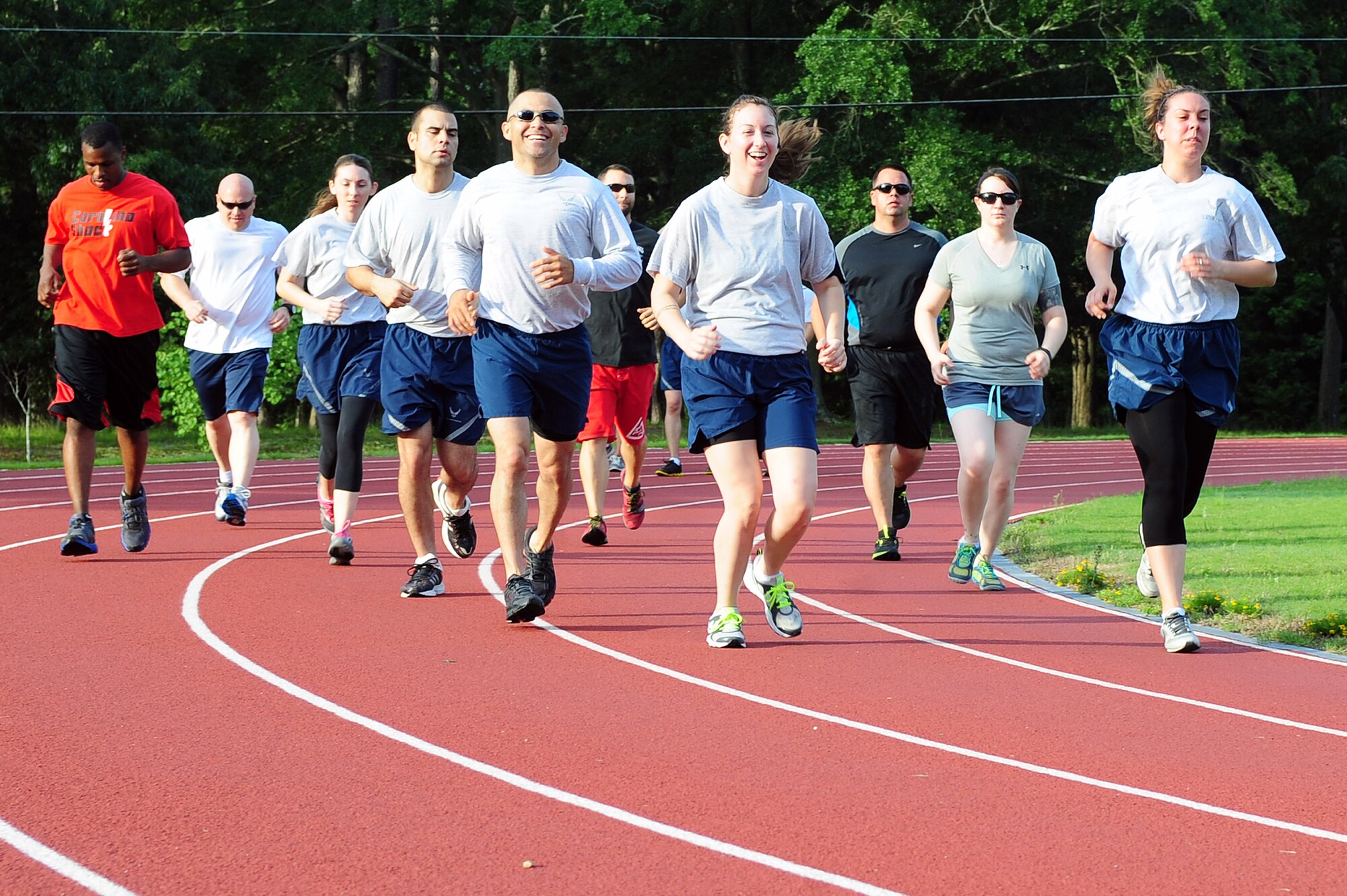Members of Team Seymour run laps during a running fundamentals class at Seymour Johnson Air Force Base, N.C., June 12, 2013. The running fundamentals class is one of the many classes the Health and Wellness Center offers to enhance readiness and provide guidance about  fitness and nutrition to the base community. (U.S. Air Force photo by Airman 1st Class John Nieves Camacho/Released)