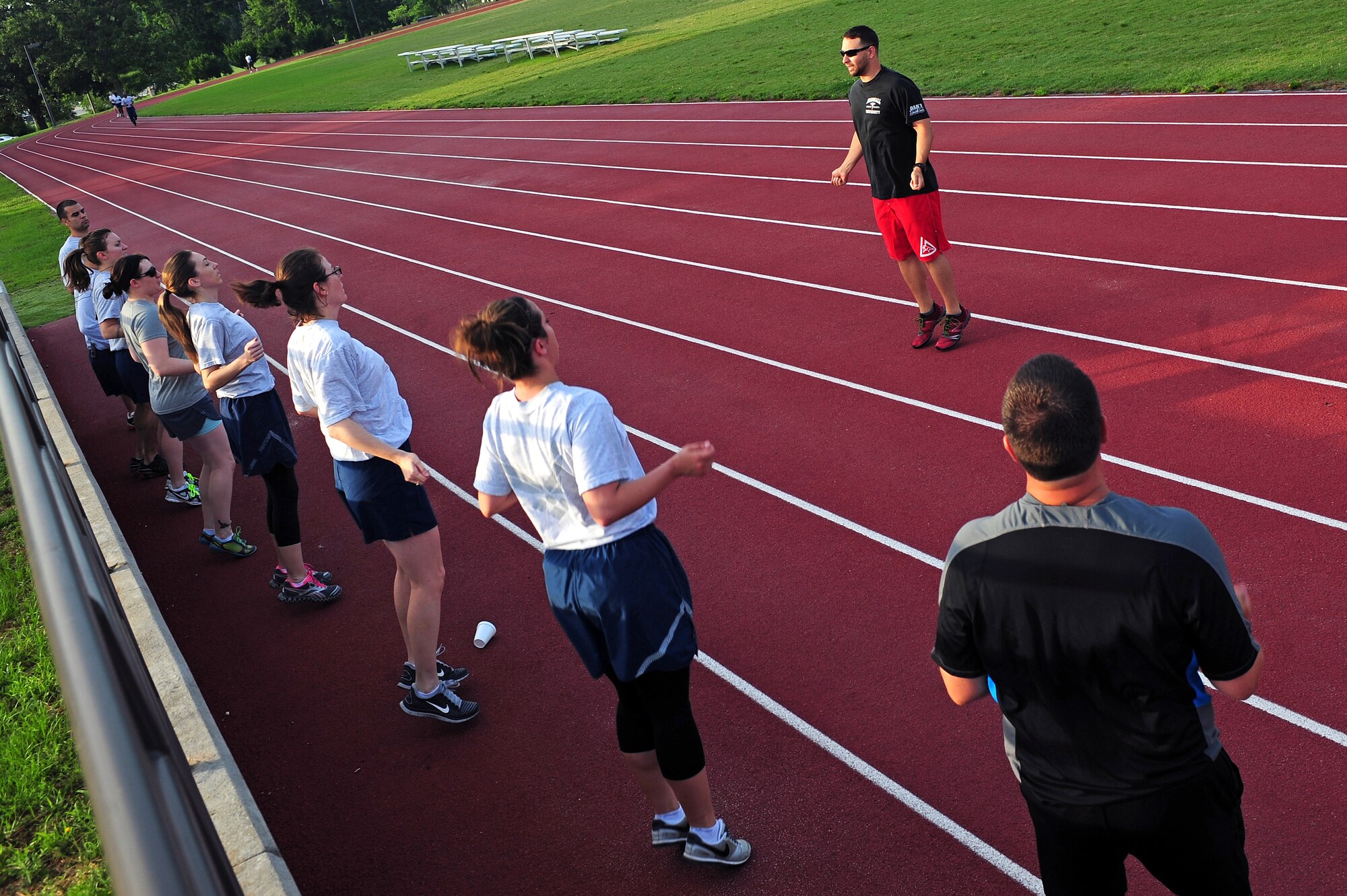 Joe Gonzalez, 4th Aerospace Medicine Squadron health and wellness center physiologist, leads a jump rope exercise during a running fundamentals class at Seymour Johnson Air Force Base, N.C., June 12, 2013. The running fundamentals class helps prepare Airmen for upcoming physical training assessments. (U.S. Air Force photo by Airman 1st Class John Nieves Camacho/Released)