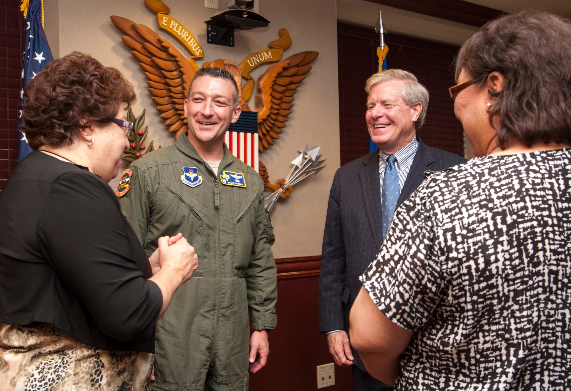 Texas Secretary of State John Steen along with Col. Brian Hastings, 47th Flying Training Wing commander, speaks with Janie Gracia-Ramon, Val Verde County county clerk and Sylvia Salazar, Val Verde County elections deputy clerk, at Laughlin Air Force Base, Texas, June 12, 2013. Steen visited Laughlin on his ‘Boots and Ballots’ military voter resources and readiness outreach tour, which is designed to aid military voters by providing additional resources to help them register to vote and participate in local, state and federal elections. (U.S. Air Force photo/Senior Airman Nathan Maysonet)