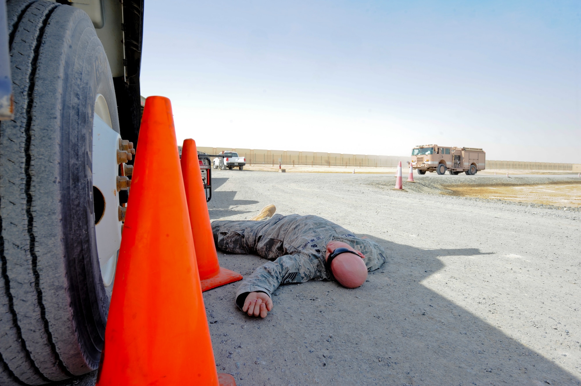 U.S. Air Force Staff Sgt. Matthew McNutt, 380th Expeditionary Civil Engineer Squadron, plays the victim during a training exercise at an undisclosed location in Southwest Asia June 10, 2013. The exercise trained members of the 380th ECES fire stations on possible real world scenarios. McNutt is a native of St. Joseph, Mo., and is deployed from Moody Air Force Base, Ga. (U.S. Air Force photo by Staff Sgt. Joshua J. Garcia)