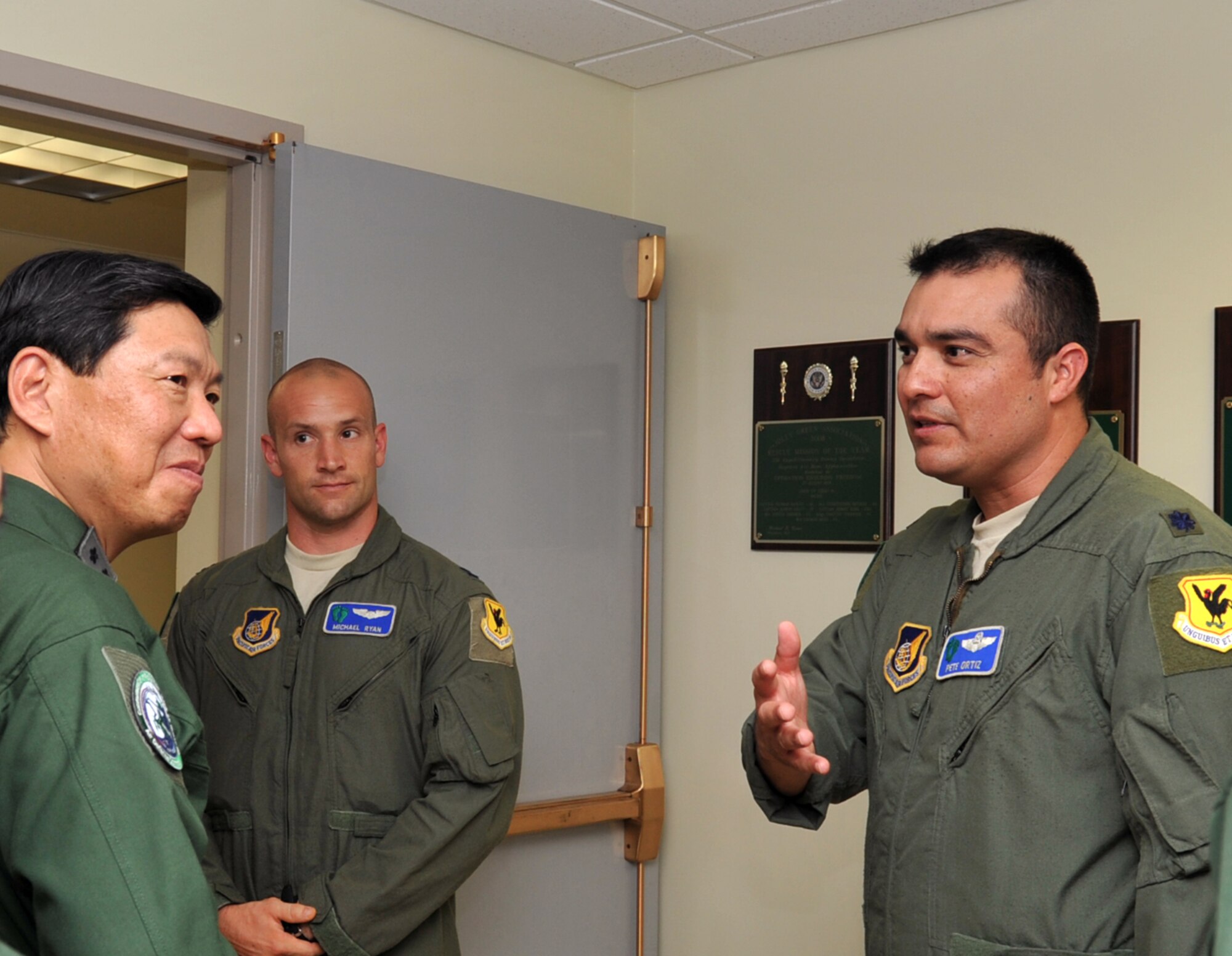 U.S. Air Force Lt. Col. Pete Ortiz, 33rd Rescue Squadron deputy commander, welcomes Japan Air Self Defense Force Lt. Gen. Kozo Ishino, Air Rescue Wing commander, at the 33rd RQS facility on Kadena Air Base, Japan, June 12, 2013. Ishino and JASDF members visit the 33rd RQS to learn more about its mission. (U.S. Air Force photo by Naoto Anazawa/Released)