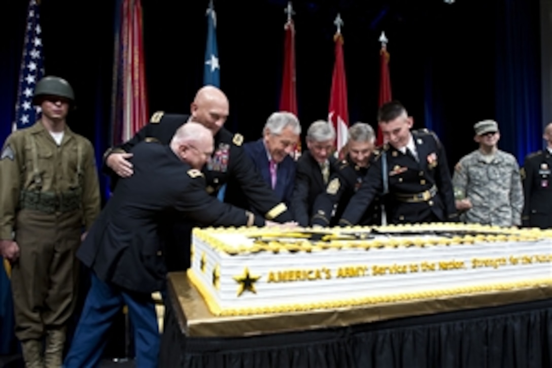 From left, Army Col. Arthur Wittich, the oldest soldier serving in the Military District of Washington; Army Chief of Staff Gen. Ray Odierno; Defense Secretary Chuck Hagel; Secretary of the Army John M. McHugh; Sgt. Maj. of the Army Raymond F. Chandler III and Pvt. 1st Class Andrew Segla, the youngest soldier serving in the Military District of Washington; cut the Army’s birthday cake during a ceremony marking its 238th birthday at the Pentagon, June 13, 2013. 