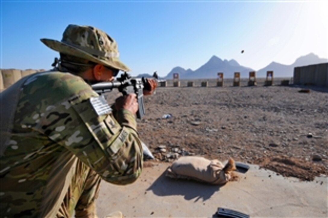U.S. Navy Petty Officer 3rd Class Brian Mays participates in a rifle qualification range on Forward Operating Base Farah in Farah province, Afghanistan, June 8, 2013. Mays, a hospital corpsman, is assigned to Provincial Reconstruction Team Farah.