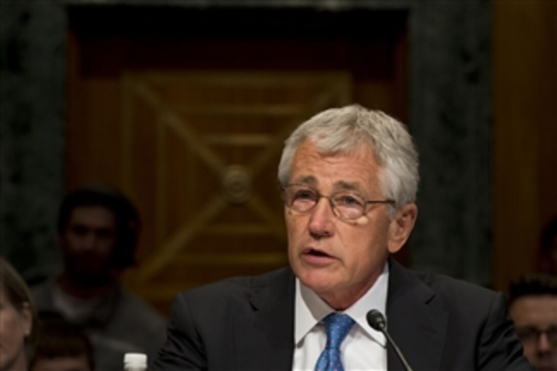 Secretary of Defense Chuck Hagel testifies before the Senate Budget Committee in the Dirksen Senate Office Building in Washington, D.C., on June 12, 2013.  Chairman of the Joint Chiefs of Staff Gen. Martin E. Dempsey joined Hagel in defending the president’s request for $526.6 billion for the Defense Department’s fiscal year 2014 budget.  