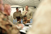 Capt. Glenn T. Jensen, the 26th Marine Expeditionary Unit liaison at U.S. Marine Corps Forces Central Command (Forward), and a Peoria, Az., native, briefs the commanding general of MARCENT (Fwd) at Camp Titin, Jordan, June 9, 2013, on current MEU operations taking place in the region during Exercise Eager Lion 2013.