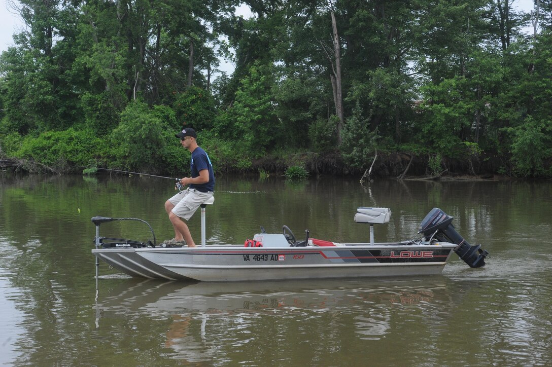 Sgt. John Dussault, rifleman at the Warfighting Instructor Battalion, fishes in the Chopawamsic Creek during the Commander’s Snakehead Fishing Tournament on June 8, 2013, aboard Marine Corps Base Quantico. Around 40 competitors cast their lines during the 24-hour competition.