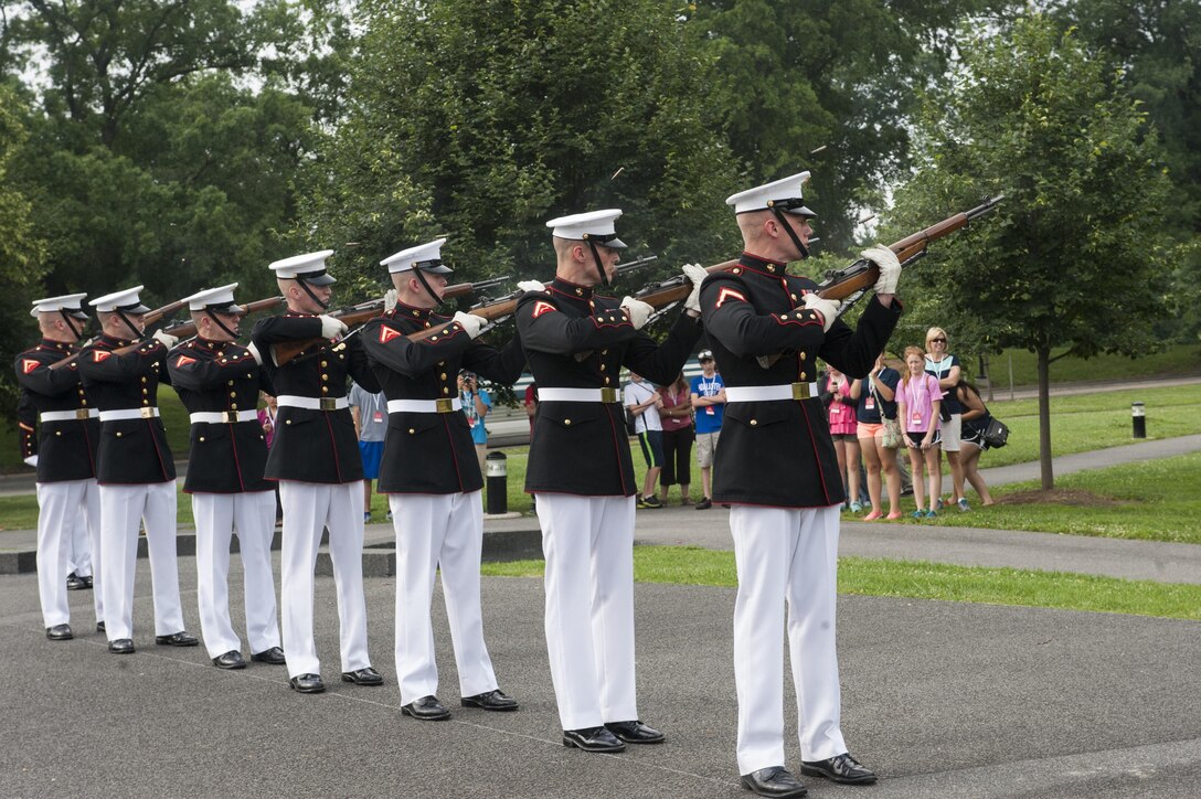 A Marine Barracks Washington, D.C., ceremonial firing party fires a 3-shot volley during a wreath-laying ceremony for Daran Wankum, the most recent honorary Marine in Marine Corps history, at the Marine Corps War Memorial in Arlington, Va., June 13. Wankum was named an honorary Marine on June 11 due to an illness that came up during the enlistment process that prevented him from starting recruit training. He is currently in Washington as a special guest of the commandant of the Marine Corps and the Barracks.