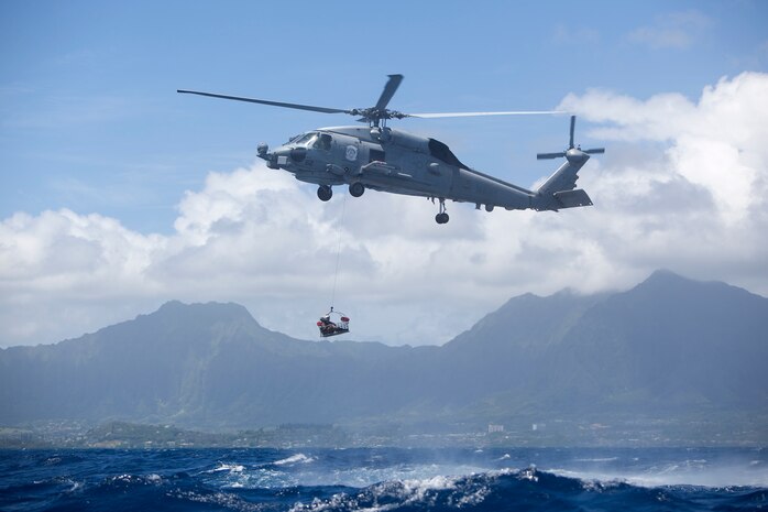 Marines with Marine Aircraft Group 24 conduct annual mishap drill training rescuing simulated survivors in Kaneohe Bay, June 11, 2013. MAG-24 coordinated with Marine Heavy Helicopter Squadron 463, Marine Light Attack Helicopter Squadron 367, Helicopter Antisubmarine Squadron Light 37, Patrol Squadron 9, Marine Corps Air Station Kaneohe Bay, Marine Corps Base Hawaii Waterfront Operations, Federal Fire Department, and the Honolulu Fire Department for this training event. (U.S. Marine Corps photo by Lance Cpl. Suzanna Lapi)