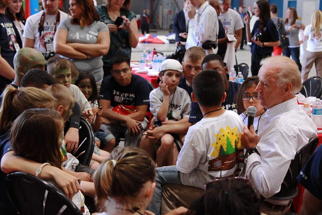 Vice President Joe Biden talks to the children of the Tragedy Assistance Program for Survivors and answer their questions at the air station here during a four-day Good Grief Camp June 14. Biden speaks about his life experiences and about being the vice president and part of the military community. T.A.P.S. is a program to help children cope with the loss of a loved one who served in the military.
