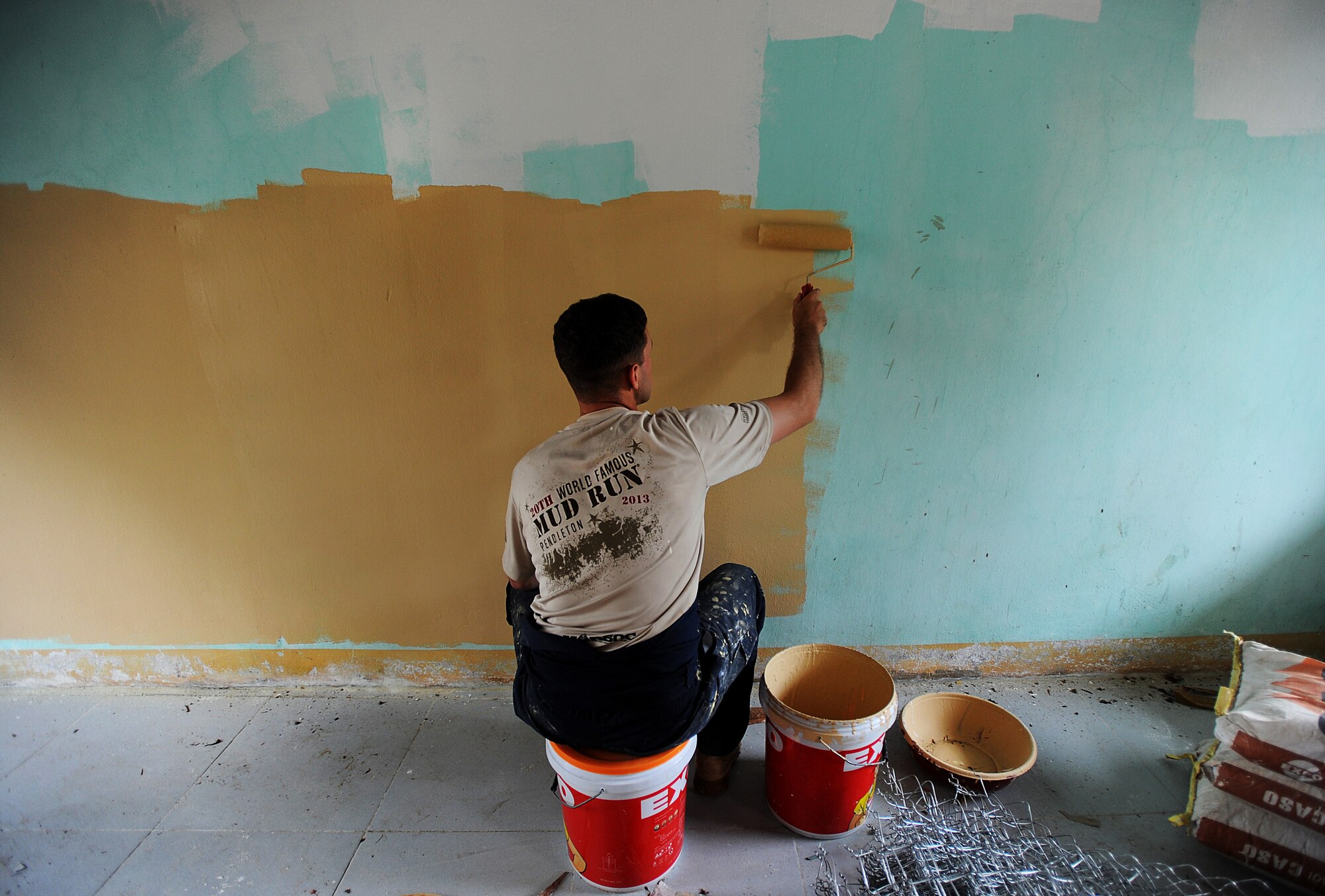 U.S. Marine Corps Sgt. Nathan Hunt, combat engineer from the 7th Engineer Support Battalion out of Camp Pendleton, San Diego, Calif. paints a room inside a newly remolded medical facility in Dong Hoi, Quang Binh Province, Vietnam, June 12, 2013. A group of nearly 20 U.S. and 10 Vietnam military members helped repair a medical facility and two schools as part of the Engineering Civil Action Programs for Operation Pacific Angel 13-3. Operation PACANGEL is a joint and combined humanitarian assistance exercise held in various countries several times a year and includes medical, dental, optometry, engineering programs and a variety of subject-matter expert exchanges. (U.S. Air Force photo by Staff Sgt. Sara Csurilla)