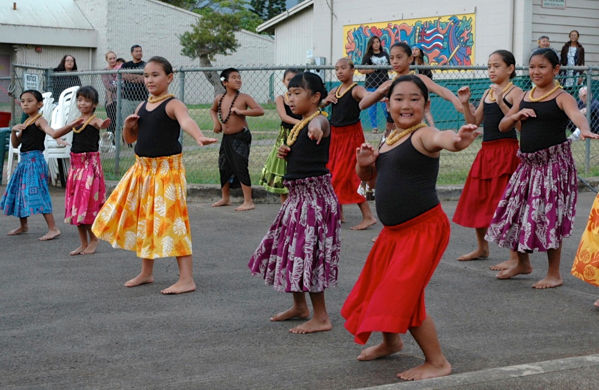 School children in Lanai City, Hawai'i, perform a hula dance at a luau hosted by residents to thank the more than 200 Reserve and Guard medical personnel on their island for TROPICARE 13, June 2-15, 2013. TROPICARE 13, a Reserve component medical Innovative Readiness Training event, provided free health services to communities throughout the Hawaiian islands. (U.S. Air Force photo / Dana Lineback) 