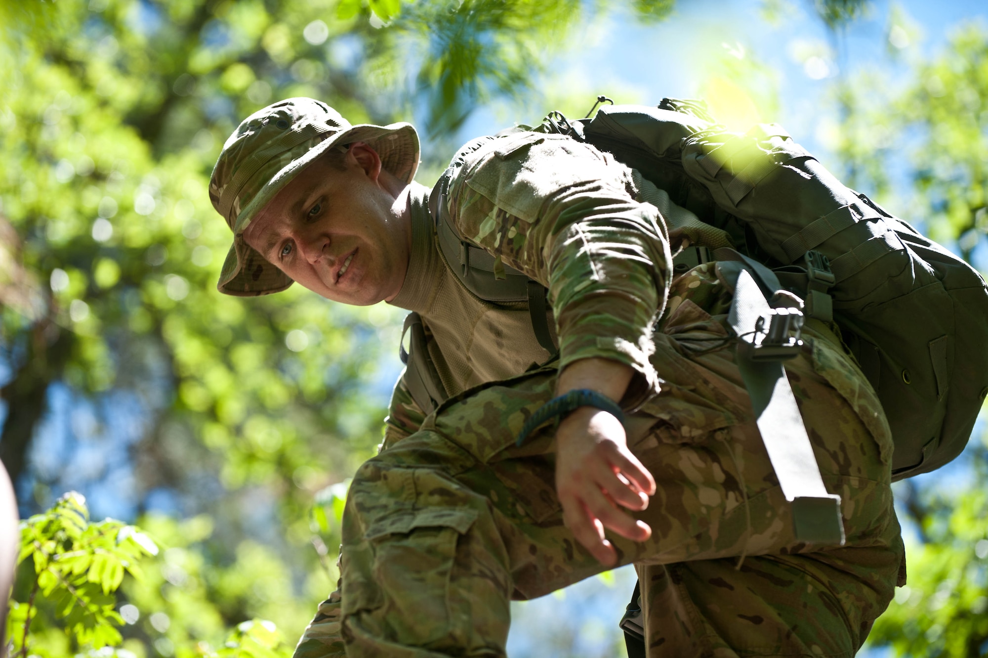First Lt. Aaron Mackie, 28th Logistics Readiness Squadron vehicle operations manager, scouts terrain during survival, evasion, resistance and escape training at the Fort Meade training range in Sturgis, S.D., June 10, 2013. During the exercise, participants had to face a variety of challenges including limited communications, obstacles, navigating sizable terrain, isolated personnel, raised elevation, heat and limited food and water resources all while avoiding an aggressive force. (U.S. Air Force photo by Airman 1st Class Zachary Hada/Released)
