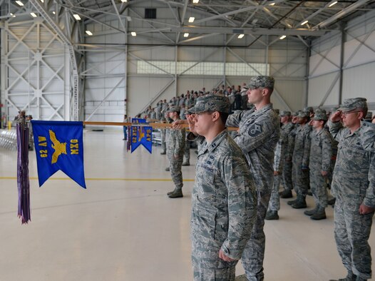 Airmen of the 62nd Maintenance Group salute their new commander for the first time during a change of command ceremony June 14, 2013 at Joint Base Lewis-McChord, Wash. Col. Craig Gaddis took command of the 62nd MXG from Col. Thomas Jackson, who will retire after 26 years of honorable service in the Air Force. (U.S. Air Force photo/Staff Sgt. Jason Truskowski)
