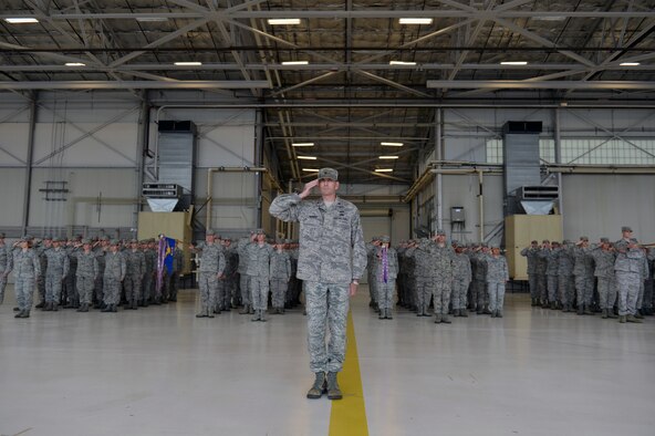 Airmen of the 62nd Maintenance Group salute their new commander during a change of command ceremony June 14, 2013 at Joint Base Lewis-McChord, Wash. Col. Craig Gaddis is the new commander of the 62nd MXG. (U.S. Air Force photo/Staff Sgt. Jason Truskowski)