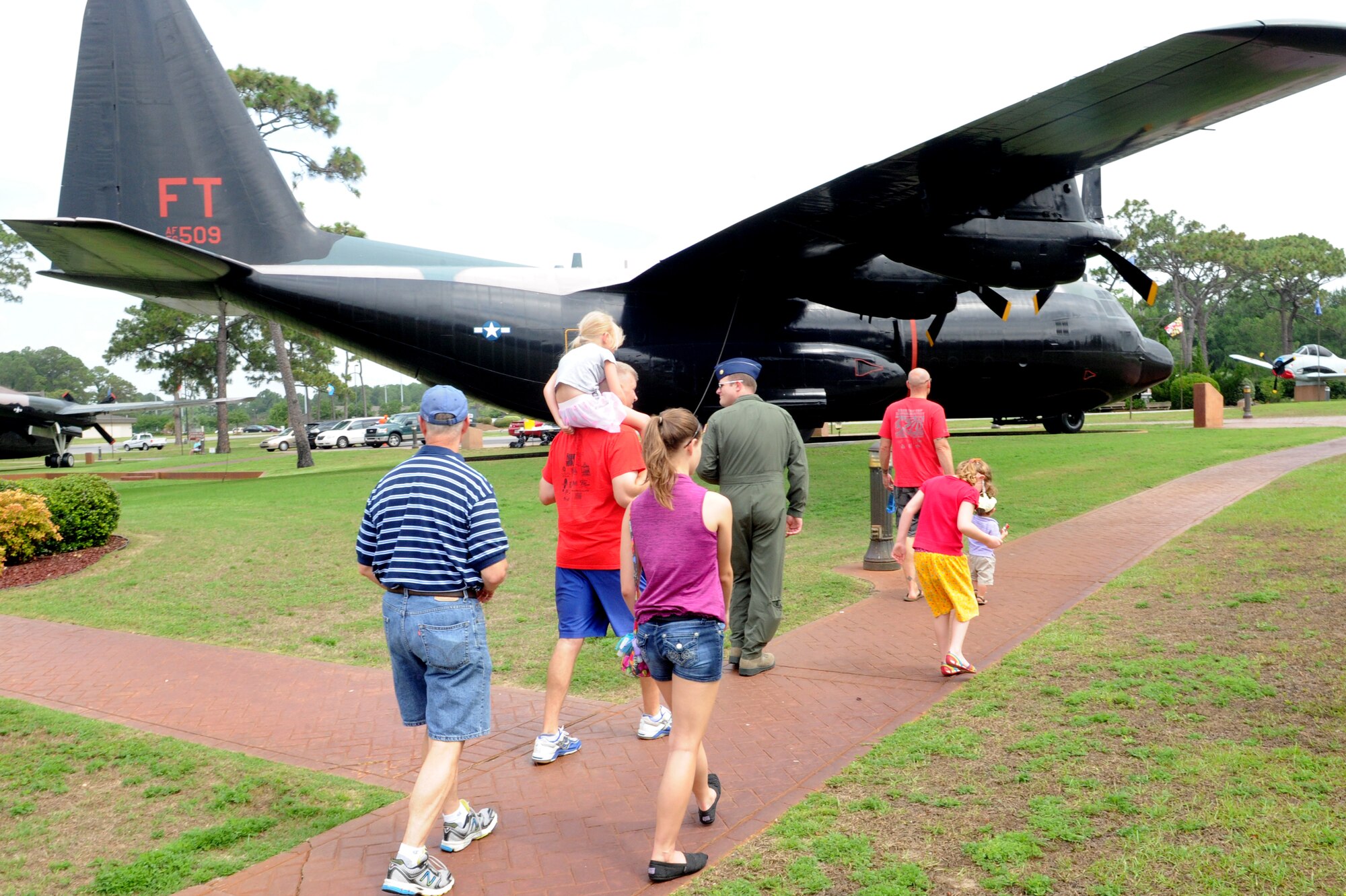 Families participate in a tour of the airpark on "bring your kid to work day" June14, 2013.The day also included the annual Air Force Special Operations Command picnic. (U.S. Air Force photo/Staff Sgt. Eboni Reams)