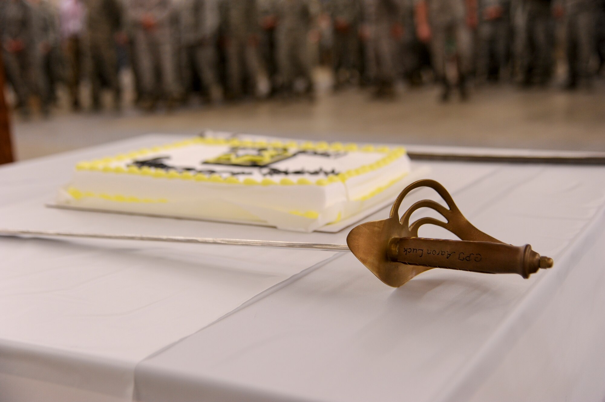 VANDENBERG AIR FORCE BASE, Calif. – U.S. Army Lt. Col. Aaron Luck’s, Joint Functional Component Command for Space chief of force enhancement, sword is placed near the U.S. Army birthday cake during a birthday party ceremony here Friday, June 14, 2013. The U.S. Army was born on June 14, 1775 and from that auspicious start has become a major fighting force built upon professional men and women ready and willing to serve their country and its people. (U.S. Air Force photo/Senior Airman Lael Huss)