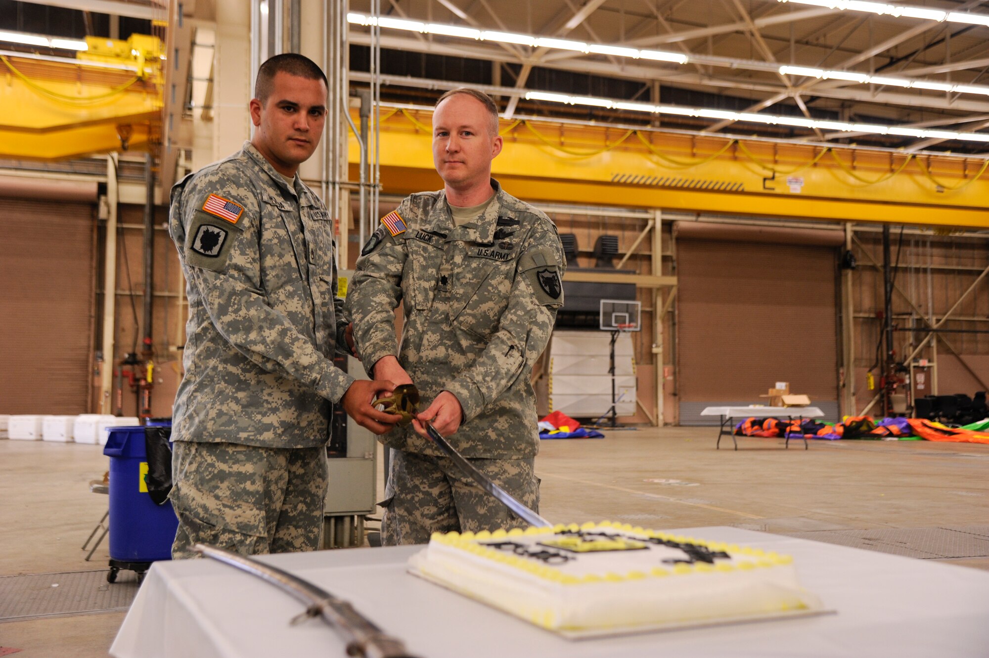 VANDENBERG AIR FORCE BASE, Calif. – Tradition dictates that the oldest soldier Lt. Col. Aaron Luck, Joint Functional Component Command for Space chief of force enhancement, and the youngest, Staff Sgt.  Daniel Pineda, 614th Air and Space Operation Center member, cuts the U.S. Army birthday cake here Friday, June 14, 2013. The U.S. Army was born on June 14, 1775, was leaderless until July 3, 1775 and since then has grown to become a major fighting force built upon professional men and women ready and willing to serve their country and its people.  (U.S. Air Force photo/Senior Airman Lael Huss)
