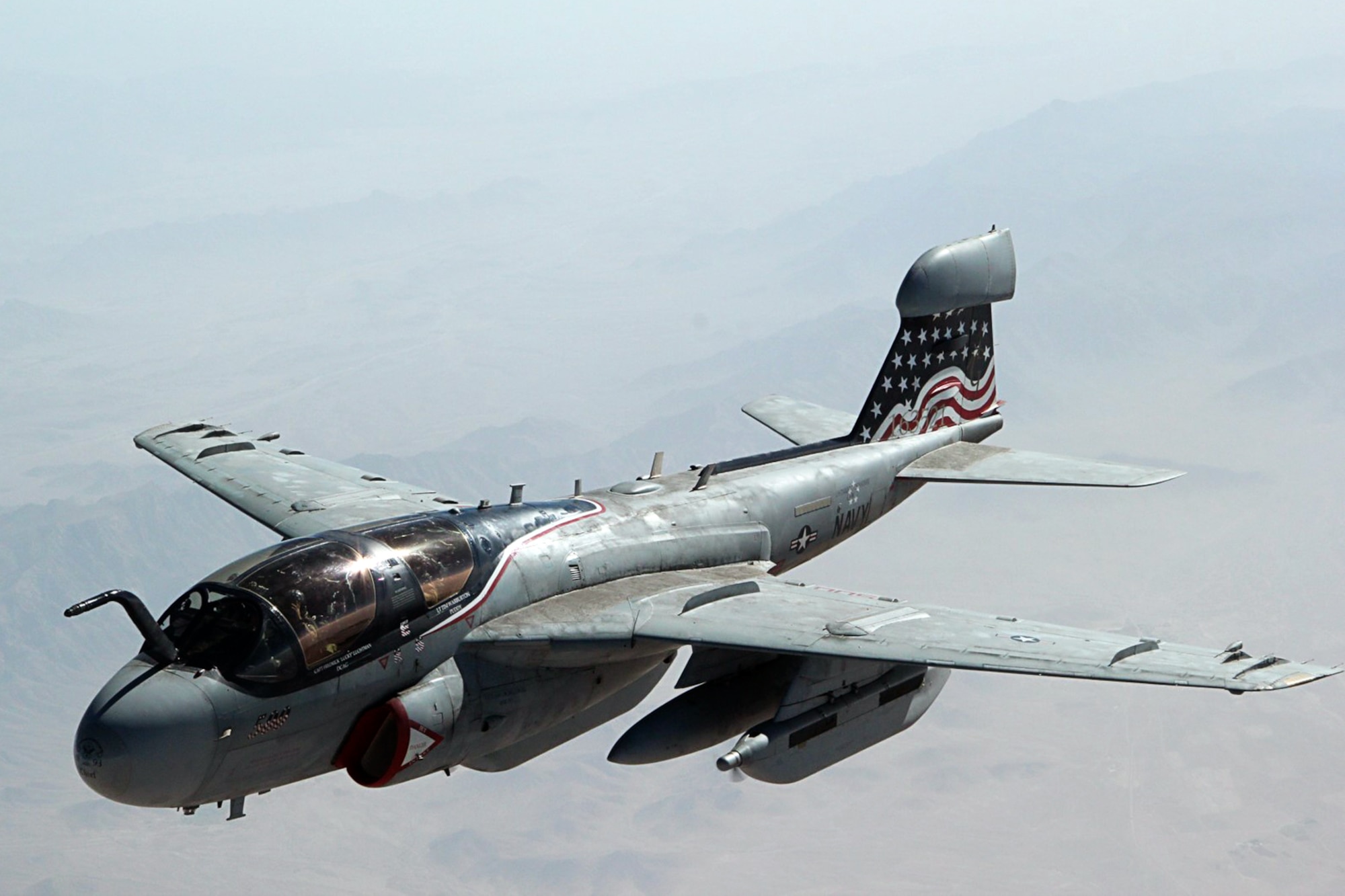 An EA-6B Prowler assigned to the Patriots of Electronic Attack Squadron (VAQ) 140, embarked aboard the aircraft carrier USS Dwight D. Eisenhower (CVN 69), flies alongside a 434th Air Refueling Wing KC-135R Stratotanker from Grissom Air Reserve Base, Ind., after refueling during a mission over Southwest Asia. Aircrew and aircraft from the 434th ARW were deployed to the region in support of Operation Enduring Freedom. The USS Dwight D. Eisenhower is deployed to the U.S. 5th Fleet area of responsibility, promoting maritime security operations, theater security cooperation efforts and support missions as part of OEF. (U.S. Air Force photo/Staff Sgt. Courtney Storey)

