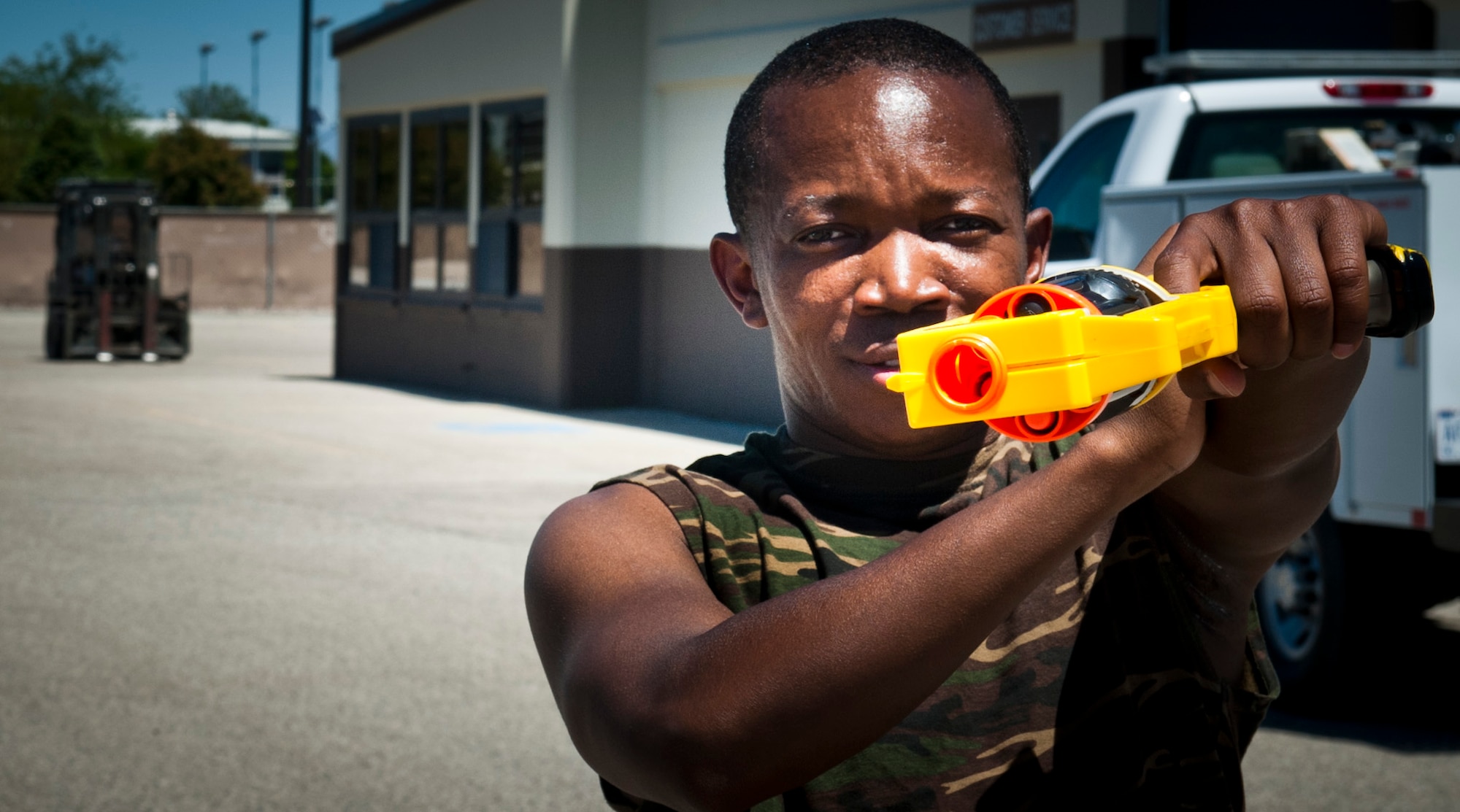 U.S. Air Force Senior Airman Urbain Dobessi, 366th Logistics Readiness Squadron management and analysis journeyman, poses for a photo June 5, 2013, at Mountain Home Air Force Base, Idaho. Dobessi was one of many “humans” who participated in a team building exercise which involved killing zombies with nerf guns. (U.S. Air Force photo by Airman 1st Class Malissa Lott/Released)