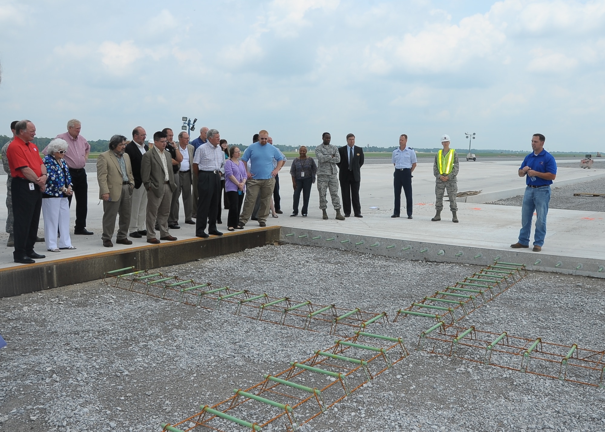 John Trumm, 14th Civil Engineer Squadron, informs visitors on the runway tour about the progress on the Center Runway construction project. The 12,000 foot runway is about 66 percent complete, and is scheduled to be complete late August. (U.S. Air Force Photo/ Airman 1st Class Stephanie Englar)