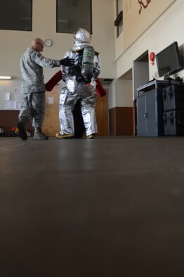 Staff Sgt. Adam Mercer, 2nd Civil Engineer Squadron, drags a training dummy on Barksdale Air Force Base, La., June 13, 2013. Mercer completed his annual self contained breathing apparatus certification and firefighter fitness test. (U.S. Air Force photo/Senior Airman Micaiah Anthony)