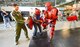 Ms. S. Renee Smith, Honorary Commander for the 436th Aircraft Maintenance Squadron, (wearing jeans) wields a simulated ASP baton while sparring with a 436th Security Forces Squadron member wearing a protective red suit to experience some of the training Raven's go through during an in-depth tour of Dover Air Force Base, Delaware's 436th Security Forces Squadron, June 5, 2013.Raven's are highly trained Security Forces personnel who deploy with military aircraft and provide on-site security for the aircraft around the world.  (U.S. Air Force photo/Greg L. Davis)