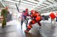 Ms. Lori Ewald, Honorary Commander for the 436th Contracting Squadron, (wearing jeans) wields a simulated ASP baton while sparring with a 436th Security Forces Squadron member wearing a protective red suit to experience some of the training Raven's go through during an in-depth tour of Dover Air Force Base, Delaware's 436th Security Forces Squadron, June 5, 2013. Raven's are highly trained Security Forces personnel who deploy with military aircraft and provide on-site security for the aircraft around the world. 