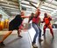 Ms. Lori Ewald, Honorary Commander for the 436th Contracting Squadron, (wearing jeans) wields a simulated ASP baton while sparring with a 436th Security Forces Squadron member wearing a protective red suit to experience some of the training Raven's go through during an in-depth tour of Dover Air Force Base, Delaware's 436th Security Forces Squadron, June 5, 2013. Raven's are highly trained Security Forces personnel who deploy with military aircraft and provide on-site security for the aircraft around the world.  (U.S. Air Force photo/Greg L. Davis)