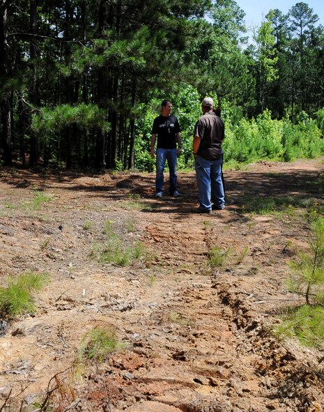 alphARace coordinators discuss details of an upcoming community event on Barksdale Air Force Base, La., June 4, 2013. The alphARace is a 3.9 mile obstacle course involving natural terrain and man-made obstacles. (U.S. Air Force photo/2nd Lt. Chris Sullivan)