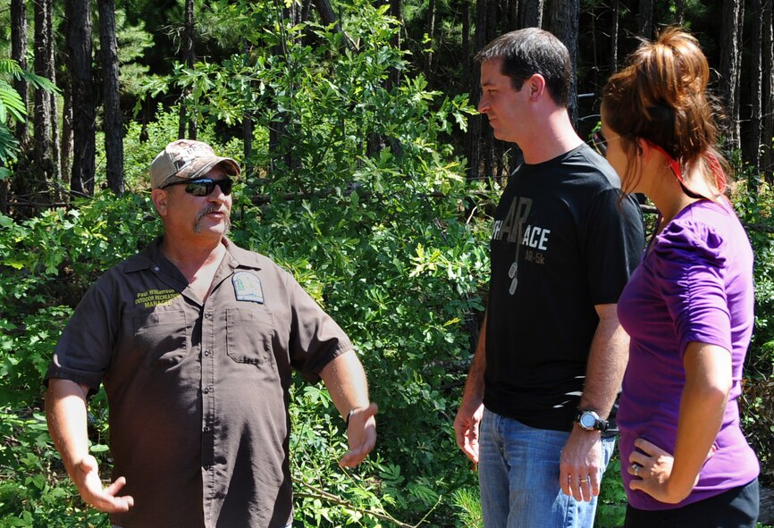 Paul Williamson, 2nd Force Support Squadron Outdoor Recreation manager, explains alphARace specifics to local community members on Barksdale Air Force Base, La., June 4, 2013. The Alpha Race is a 3.8 mile obstacle course involving natural terrain and man-made obstacles. (U.S. Air Force photo/2nd Lt. Chris Sullivan)