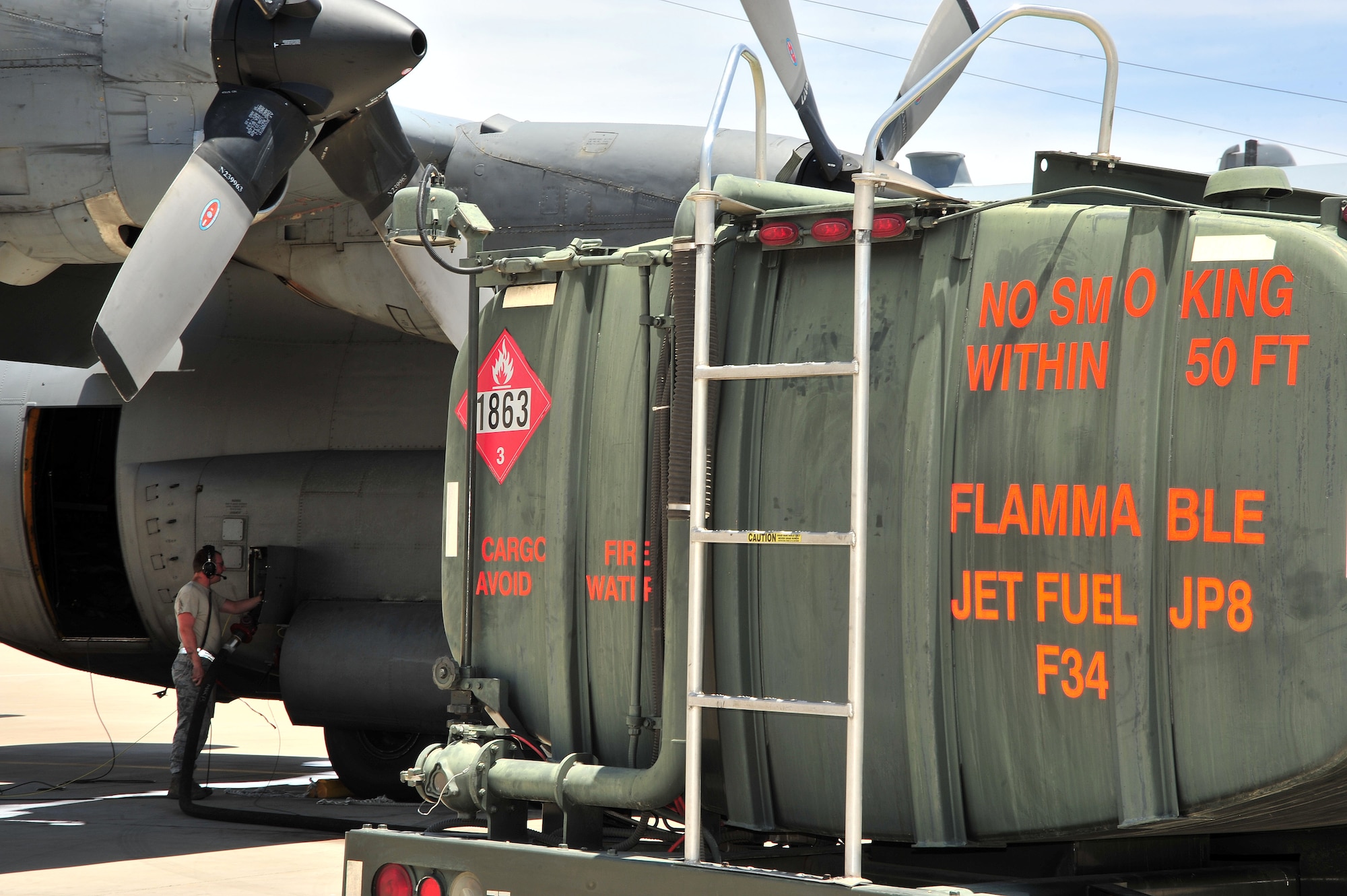 U.S. Air Force Airman 1st Class Matthew Cousens, 755th Aircraft Maintenance Squadron aerospace maintenance journeyman, refuels an EC-130H after a flight at Davis-Monthan Air Force Base, Ariz., June 12, 2013. After each flight the planes are refueled as part of an inspection.(U.S. Air Force photo by Airman 1st Class Josh Slavin/Released)