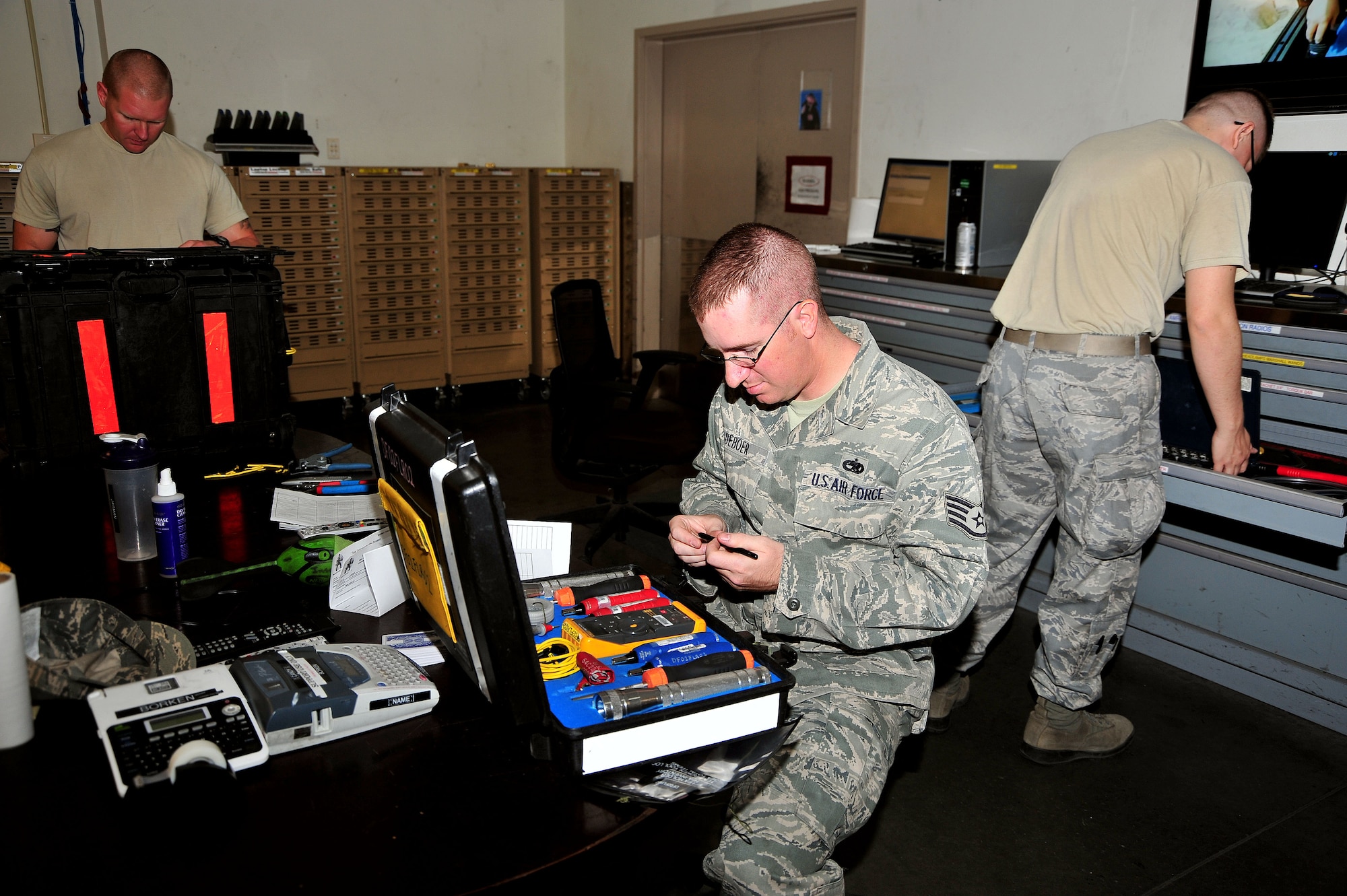 U.S. Air Force Staff Sgt. Derek Deboer, 755th Aircraft Maintenance Squadron flight control systems craftsman, performs a periodic inspection on the tools at Davis-Monthan Air Force Base, Ariz., June 12, 2013. The 755th AMXS provides war-fighting commanders with combat ready EC-130H Compass Call aircraft to expeditiously execute information warfare and electronic attack operations.(U.S. Air Force photo by Airman 1st Class Josh Slavin/Released)