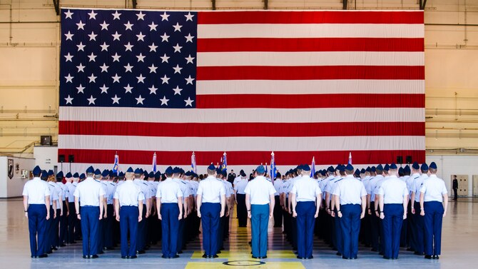 Airmen from the 552nd Air Control Wing stand at attention, in formation at the 552nd Air Control Wing change of command ceremony at Tinker Air Force Base, June 13. Col. Jay Bickley assumed command of the 552nd Air Control Wing at the ceremony and now leads the wing of over 5,000 men and women. (U.S. Air Force photo/Senior Airman Kristopher Gooden)