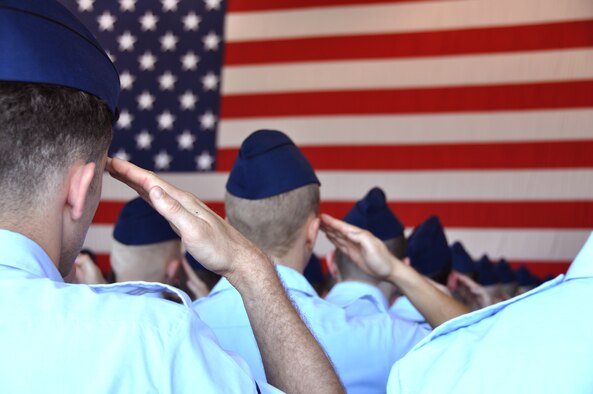 Airmen of the 552nd Air Control Wing salute to the colors during the presentation of the U.S. National Anthem at the 552nd ACW change of command ceremony at Tinker Air Force Base, June 13. (U.S. Air Force photo/Maj. Jon Quinlan)